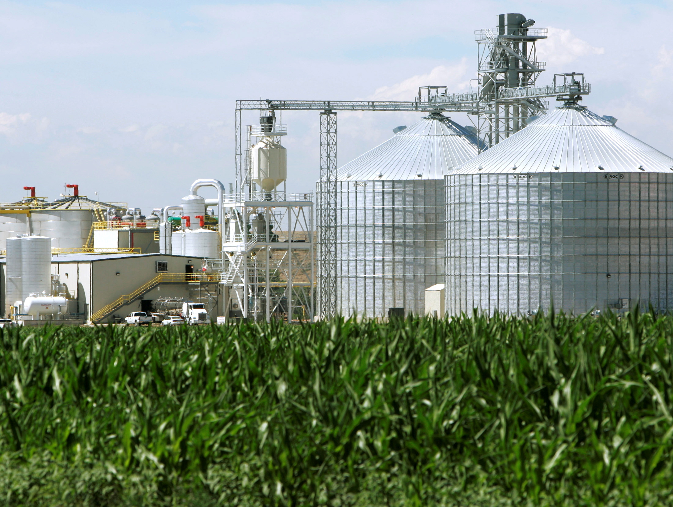 An ethanol plant with its giant corn silos next to a cornfield in Windsor, Colorado.