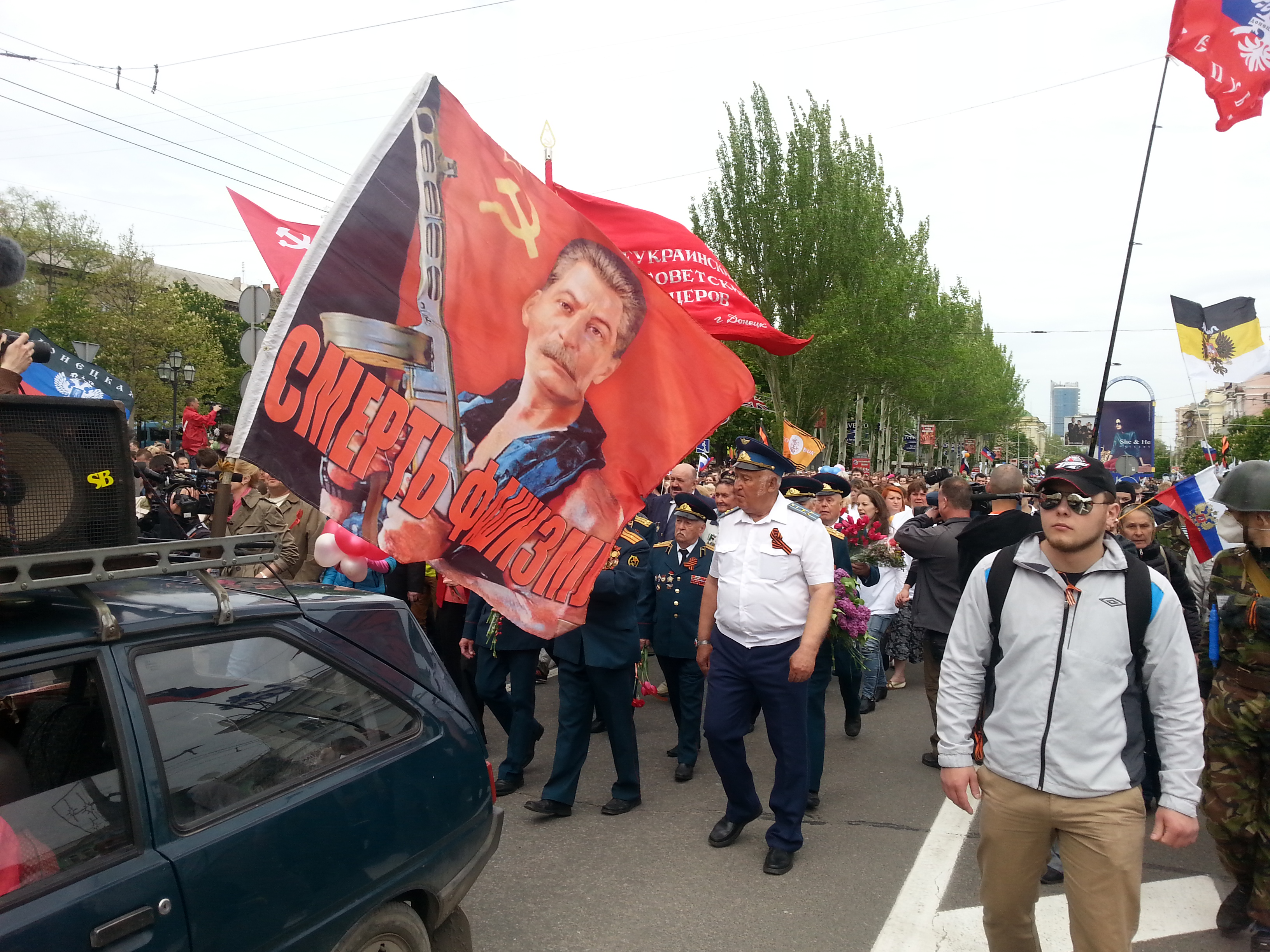 A pro-Russian rally in Donetsk, 2014. A flag with Soviet dictator Josef Stalin's portrait and a sing reading 'No to Fascism'