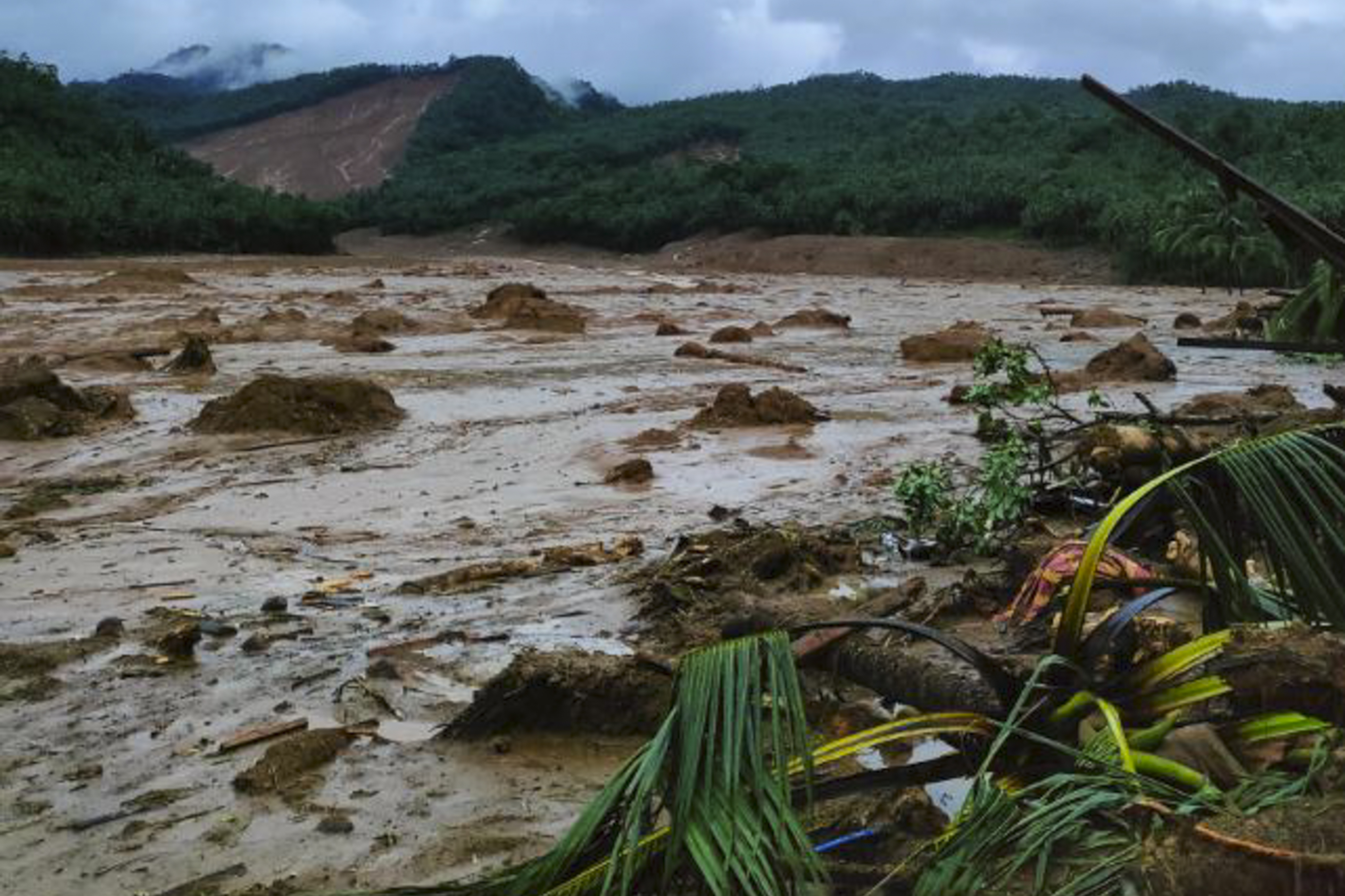 Torrents of mud and brown water at a landslide area at Baybay City, Leyte province, the Philippines.