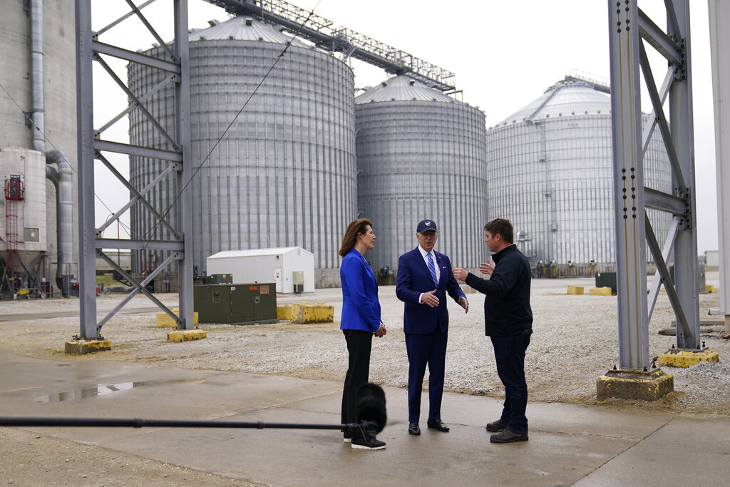President Joe Biden and Representative Cindy Axne, an Iowa Democrat, talk with Jack Mitchell, regional vice president of POET Bioprocessing, right, as he gives a tour at POET Bioprocessing in Menlo, Iowa.