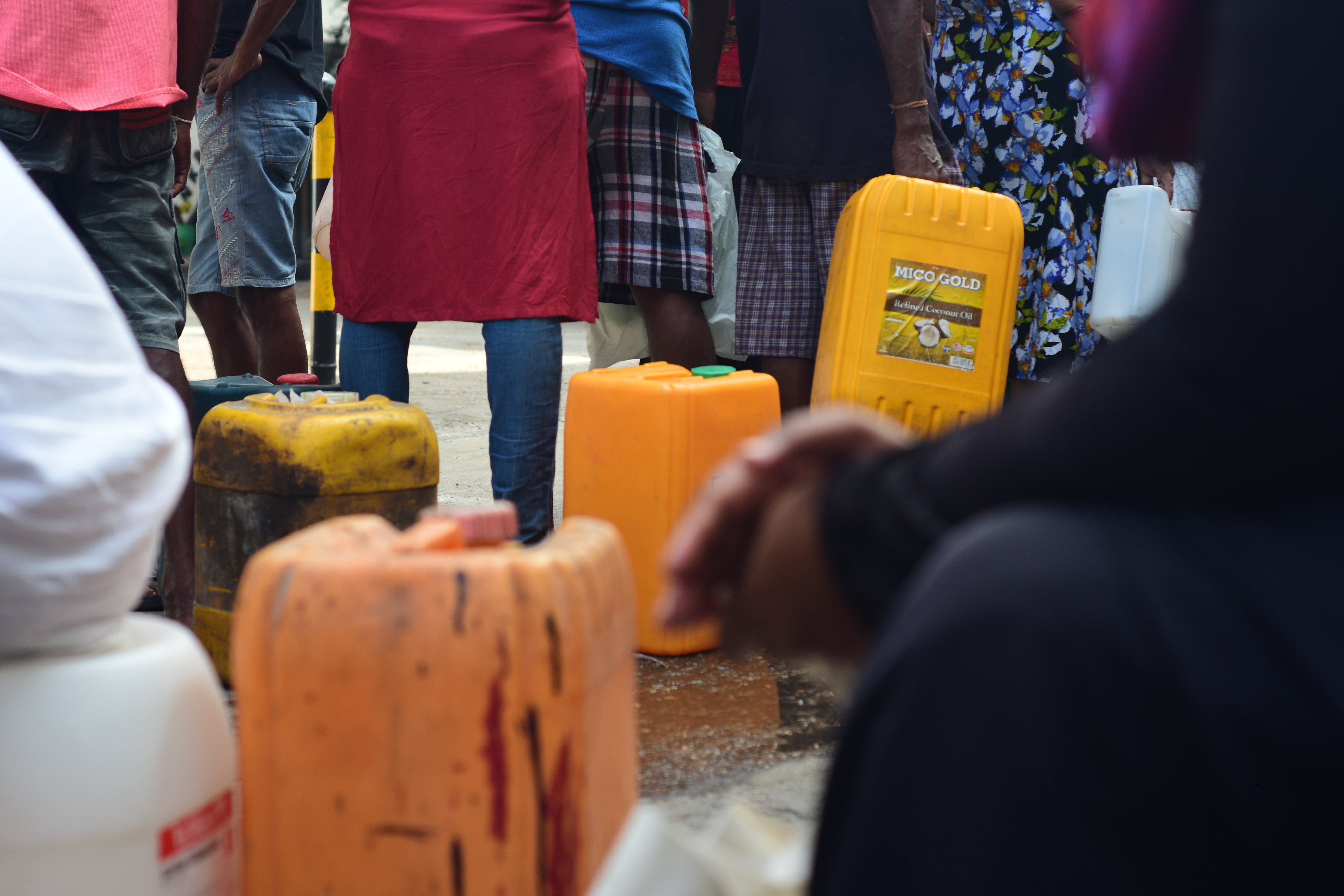 people queue up for hours in order to be able to purchase kerosene for cooking