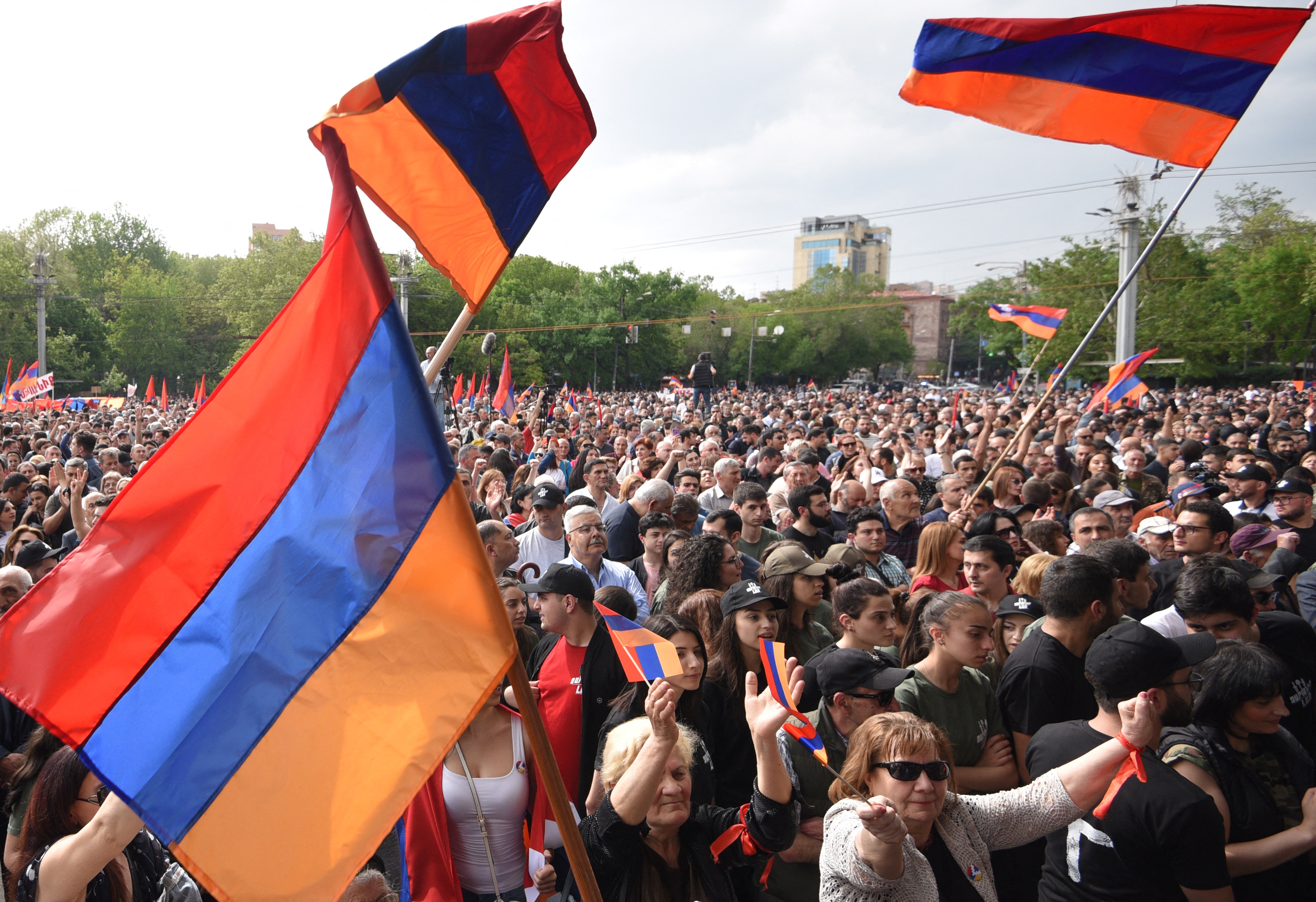 A crowd of demonstrators wave national flags as they attend an opposition rally in Yerevan on May 1, 2022, held to protest against Karabakh concessions