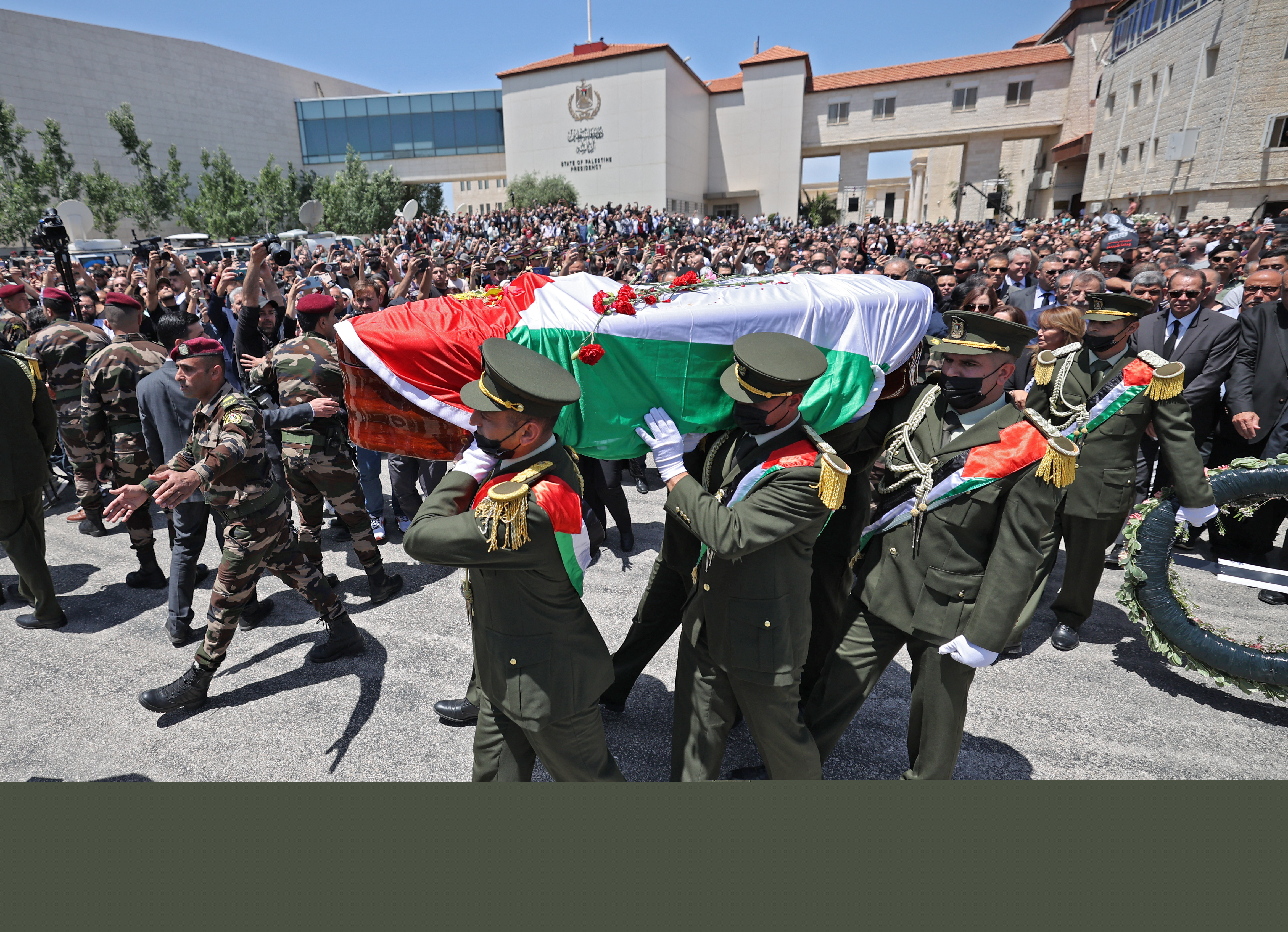 Palestinians attend a state service for veteran Al-Jazeera journalist Shireen Abu Akleh