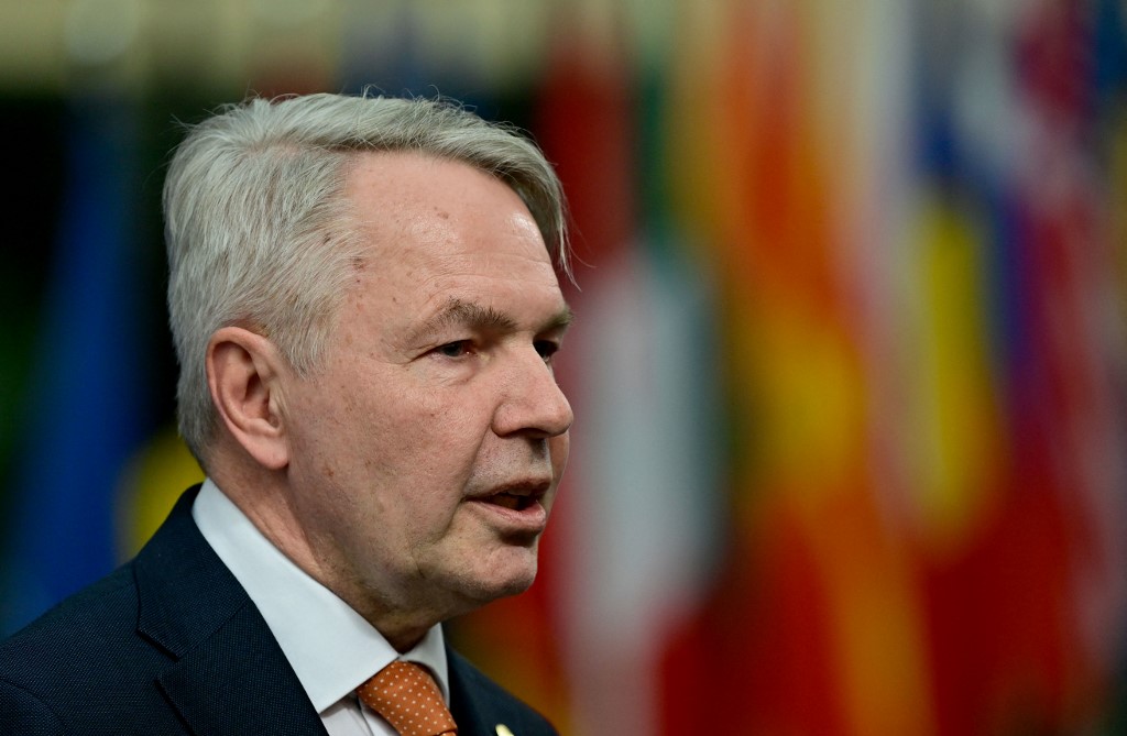 Finland's Foreign Minister Pekka Haavisto speaks to reporters