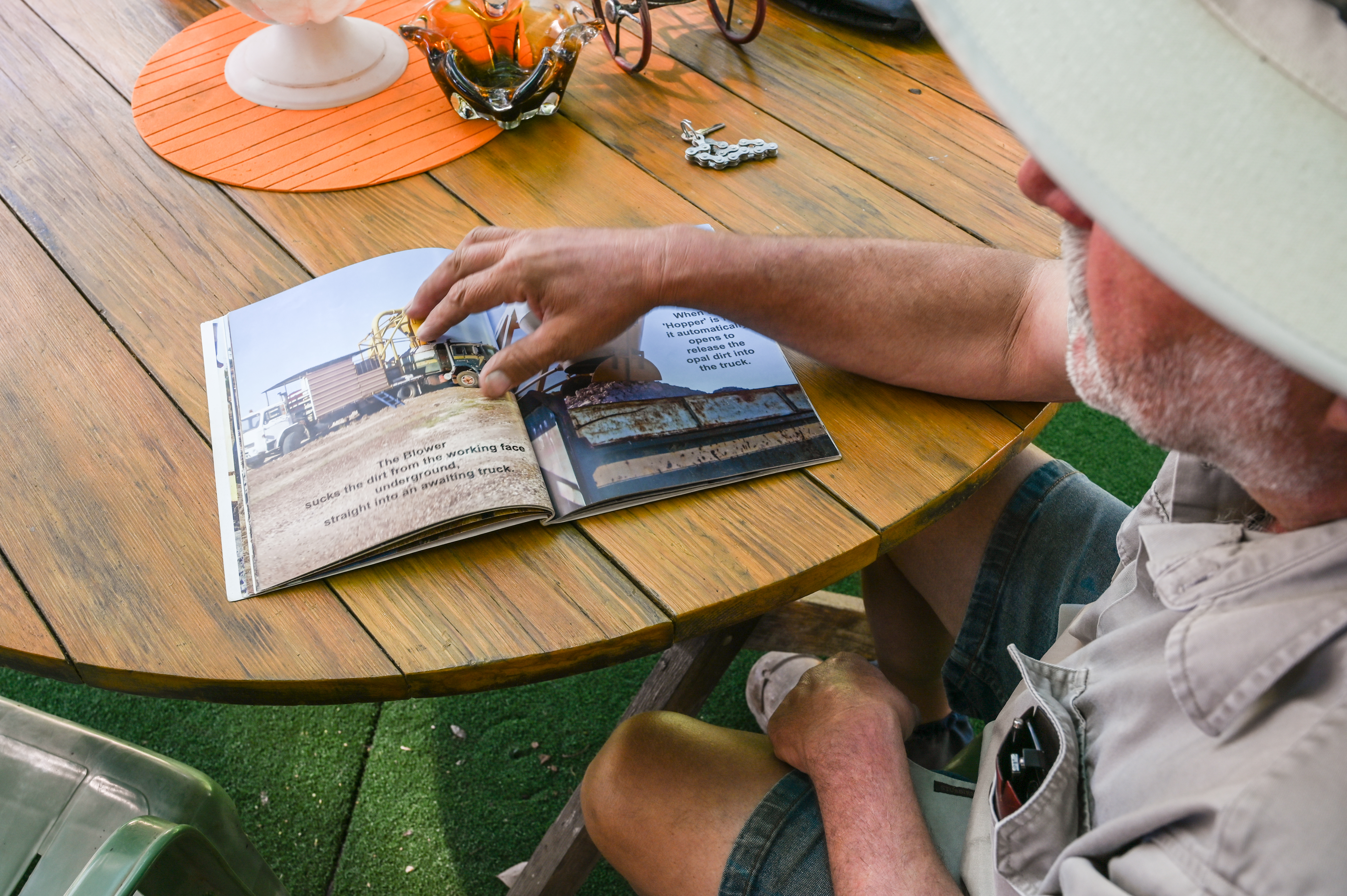 A photo of Sebastian points to a book he published.