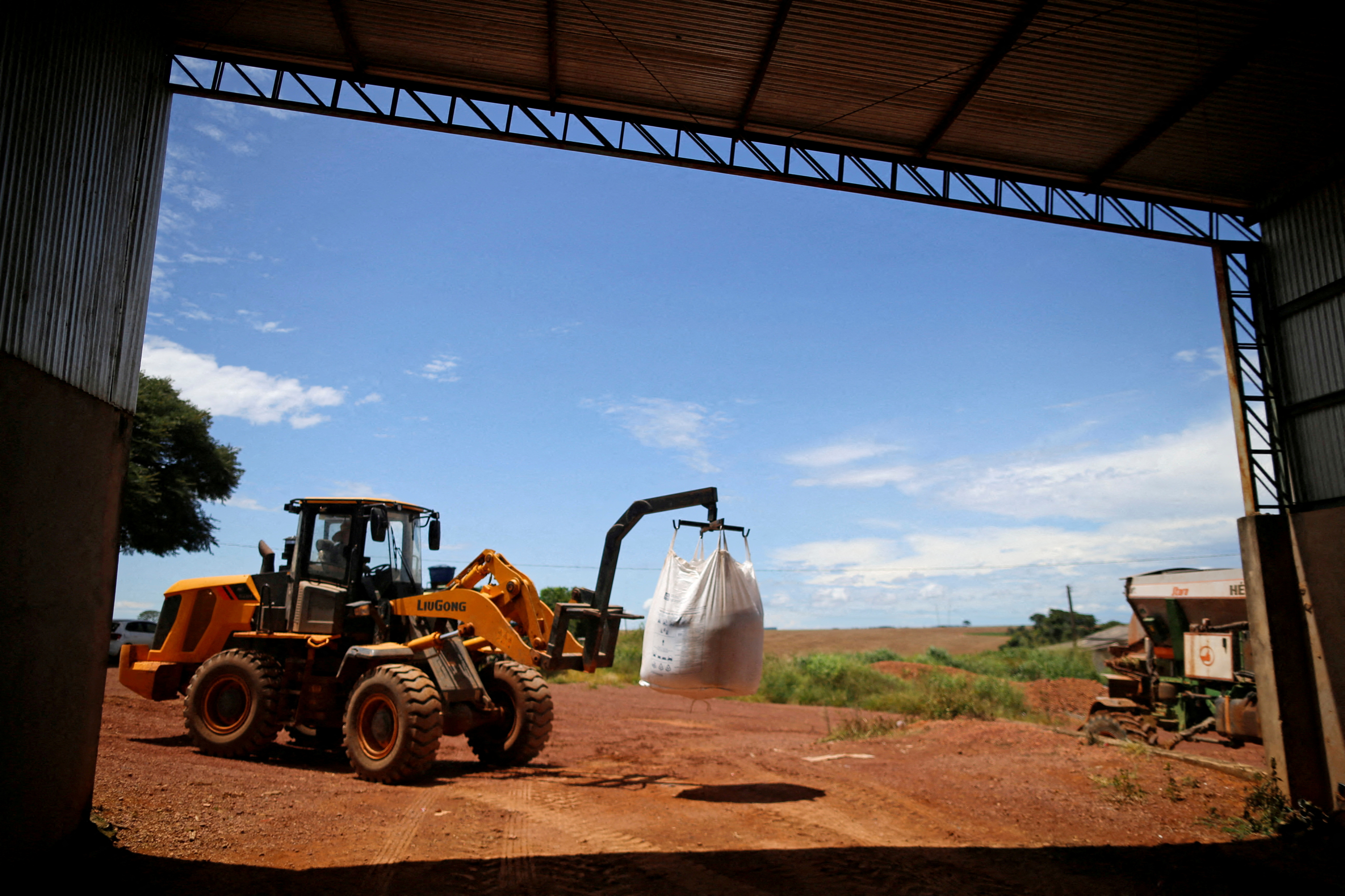 A tractor is seen loading fertilizer