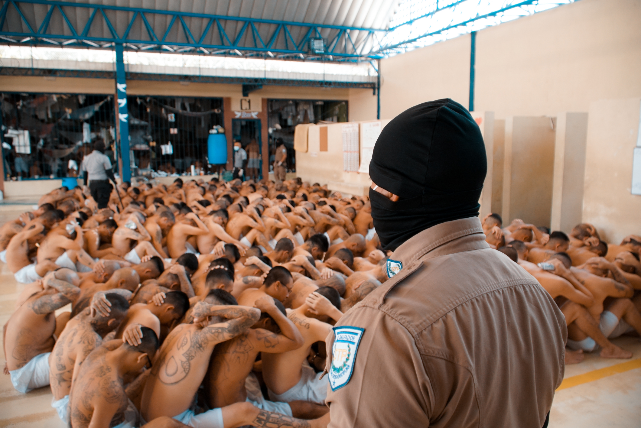 Salvadoran prisoners, in their underwear, are seen during a search in a prison.