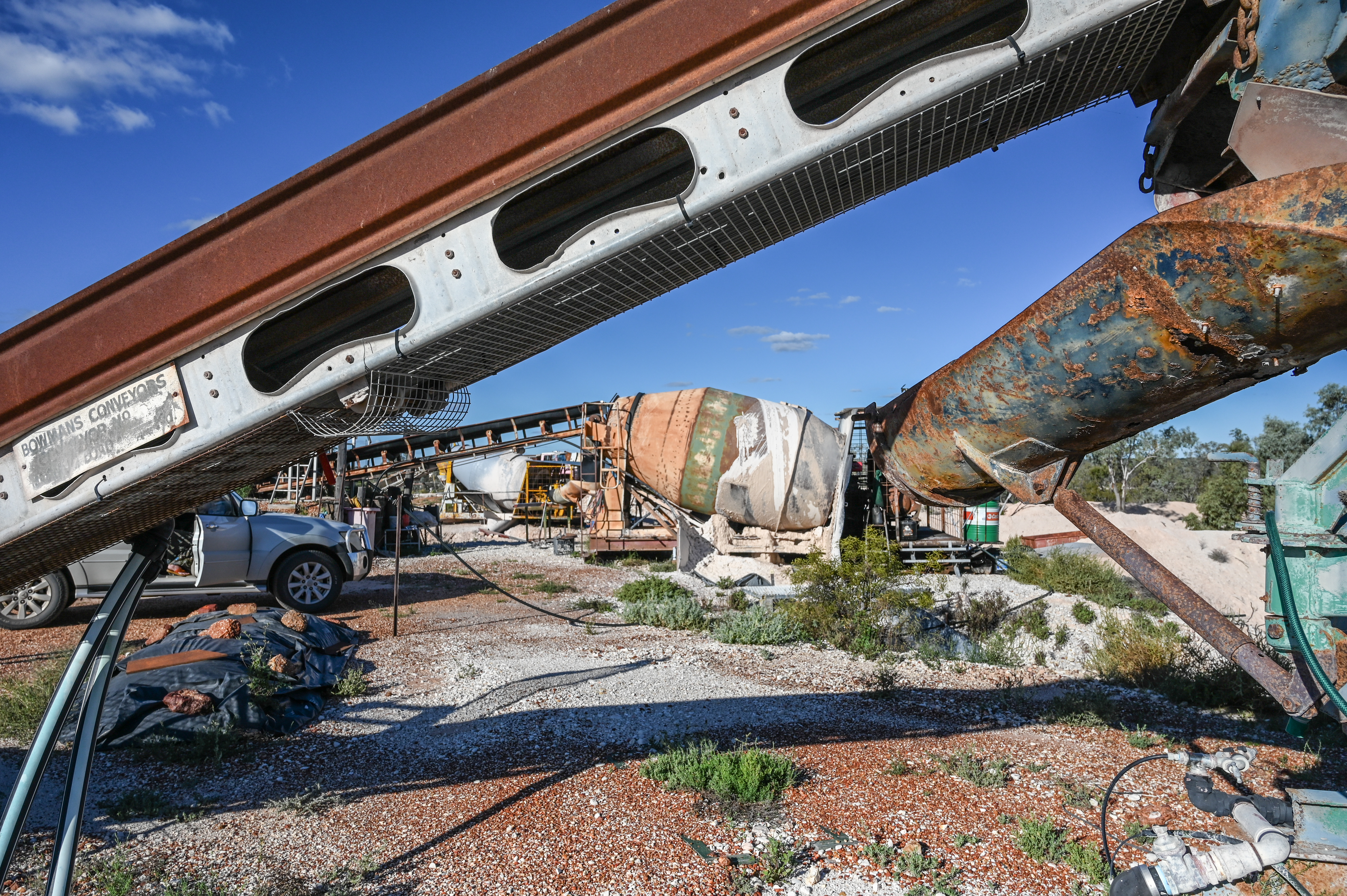 A photo of a repurposed cement mixer used to wash clay from nodules.