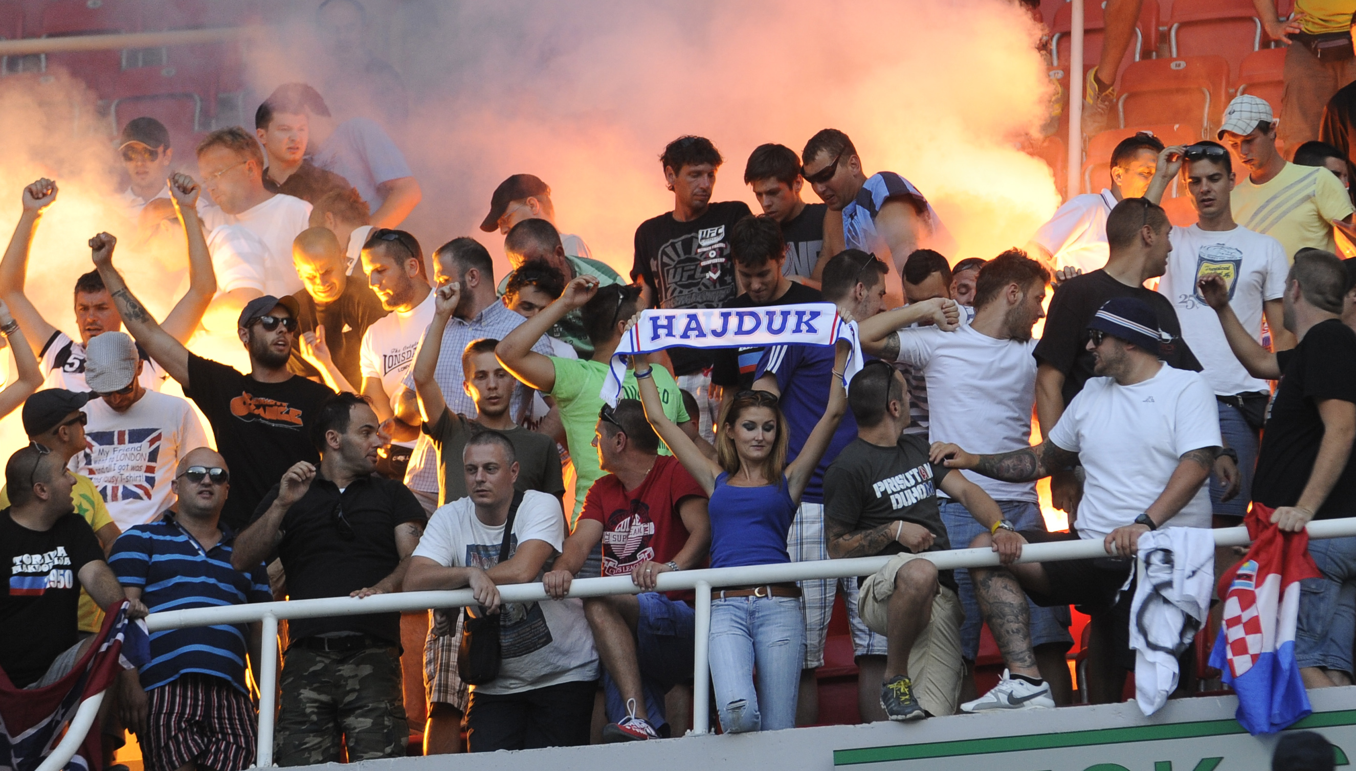 Fans of Hajduk Split celebrate after their team completed the victory in a UEFA Europa League, second round qualifier against Horizont Turnovo, at Philip II Arena in Skopje, Macedonia, Thursday, July 25, 2013.