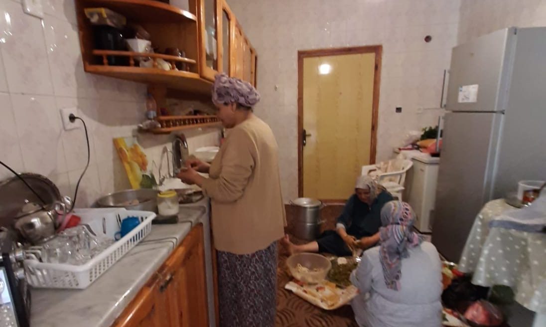A photo of the author's aunts preparing a family meal