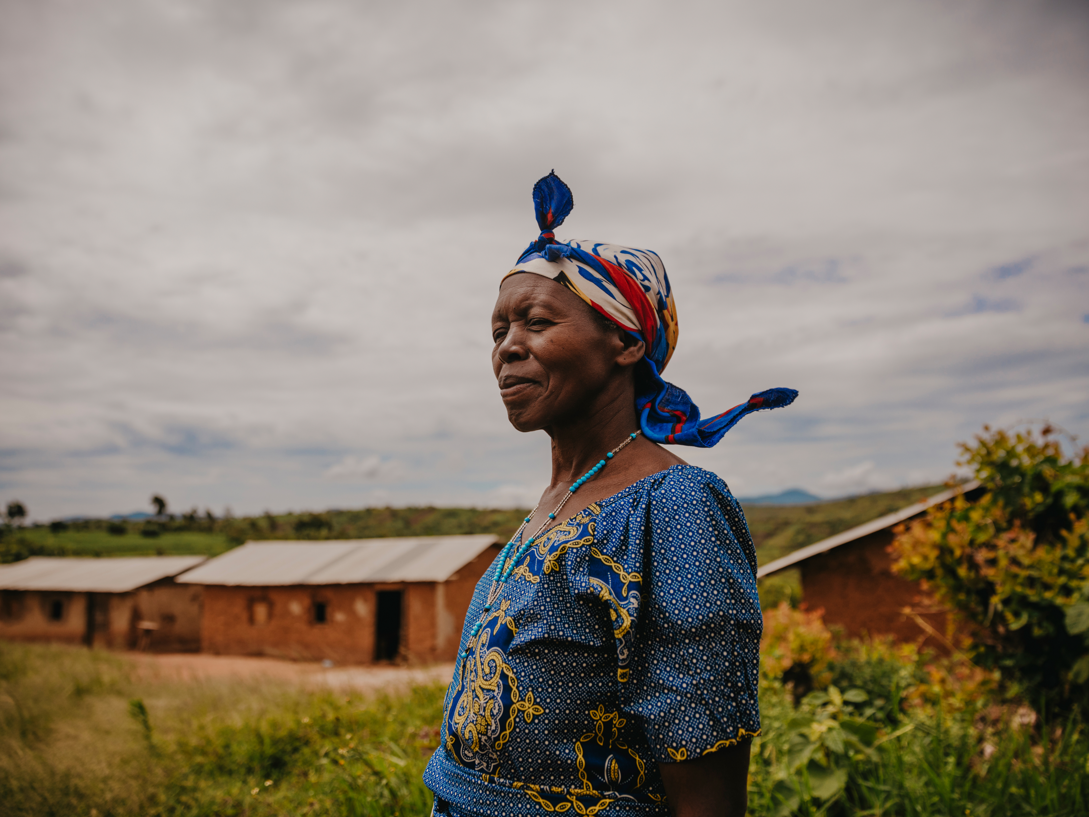 Director Rosine* stands outside an NRC-supported school close to Bule. “All of the students here are displaced. We have to finish lessons around midday to allow time for the children to walk back home. There are about 300 students enrolled here but we are missing about 70 these days. Some of the smaller children are too scared to come out.”