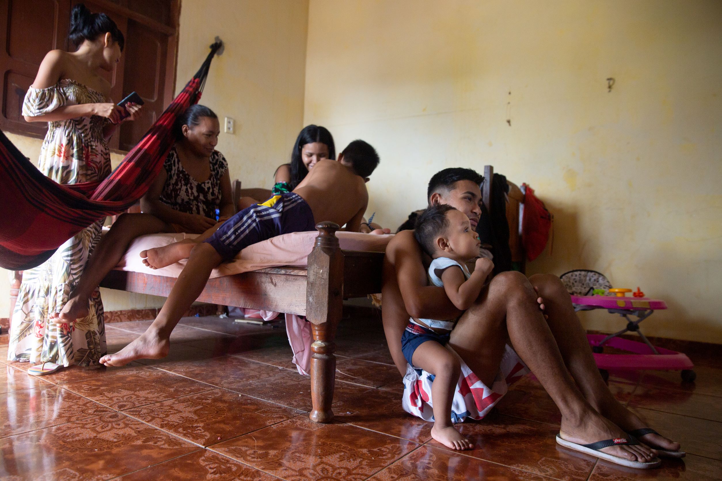 Pamela Serrao’s family gathers to watch TV together in Santana, Brazil