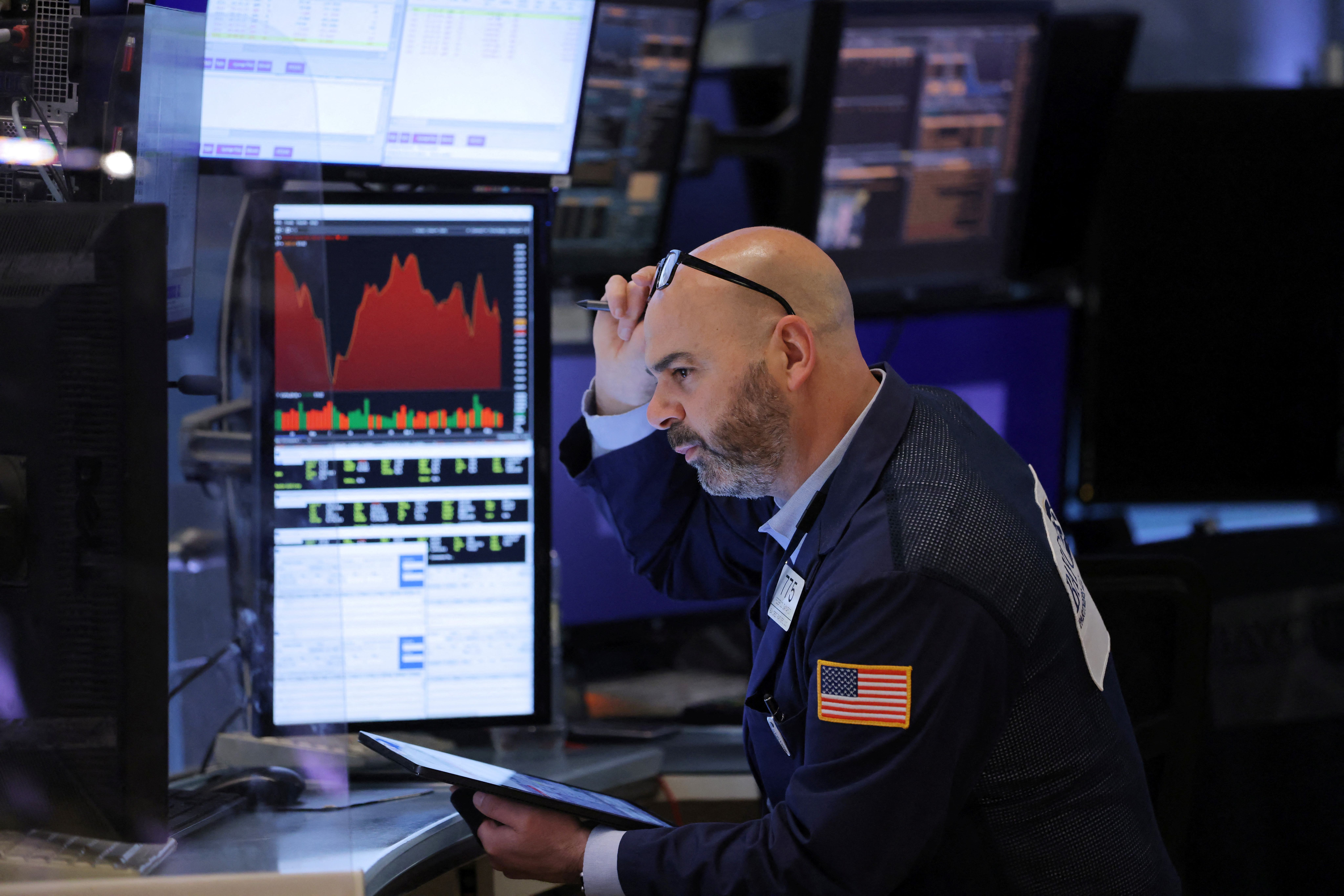 A trader works on the trading floor at the New York Stock Exchange (NYSE) in Manhattan, New York City