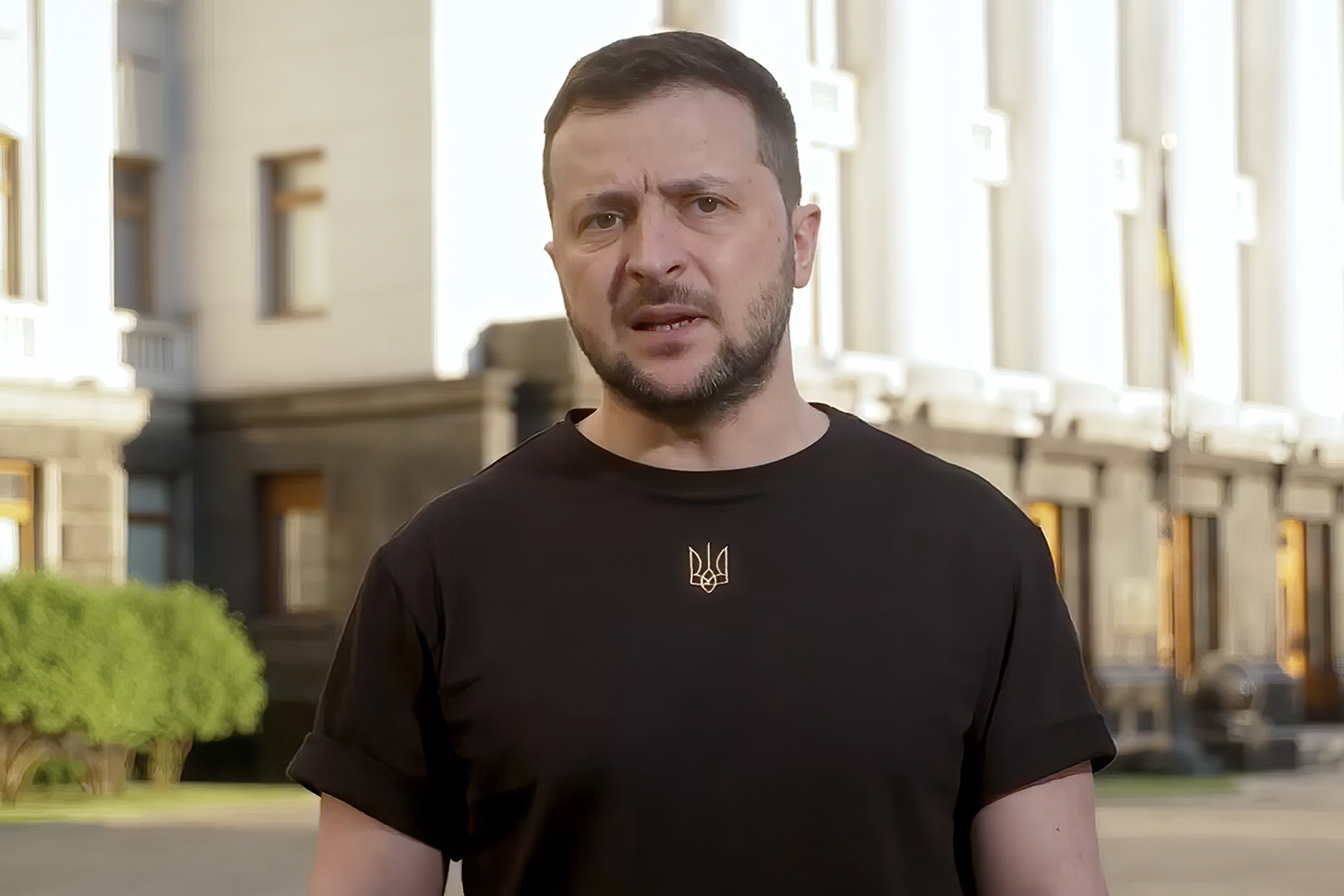 Ukrainian President Volodymyr Zelenskyy in black t-shirt in a still from a video speech on the streets of Kyiv