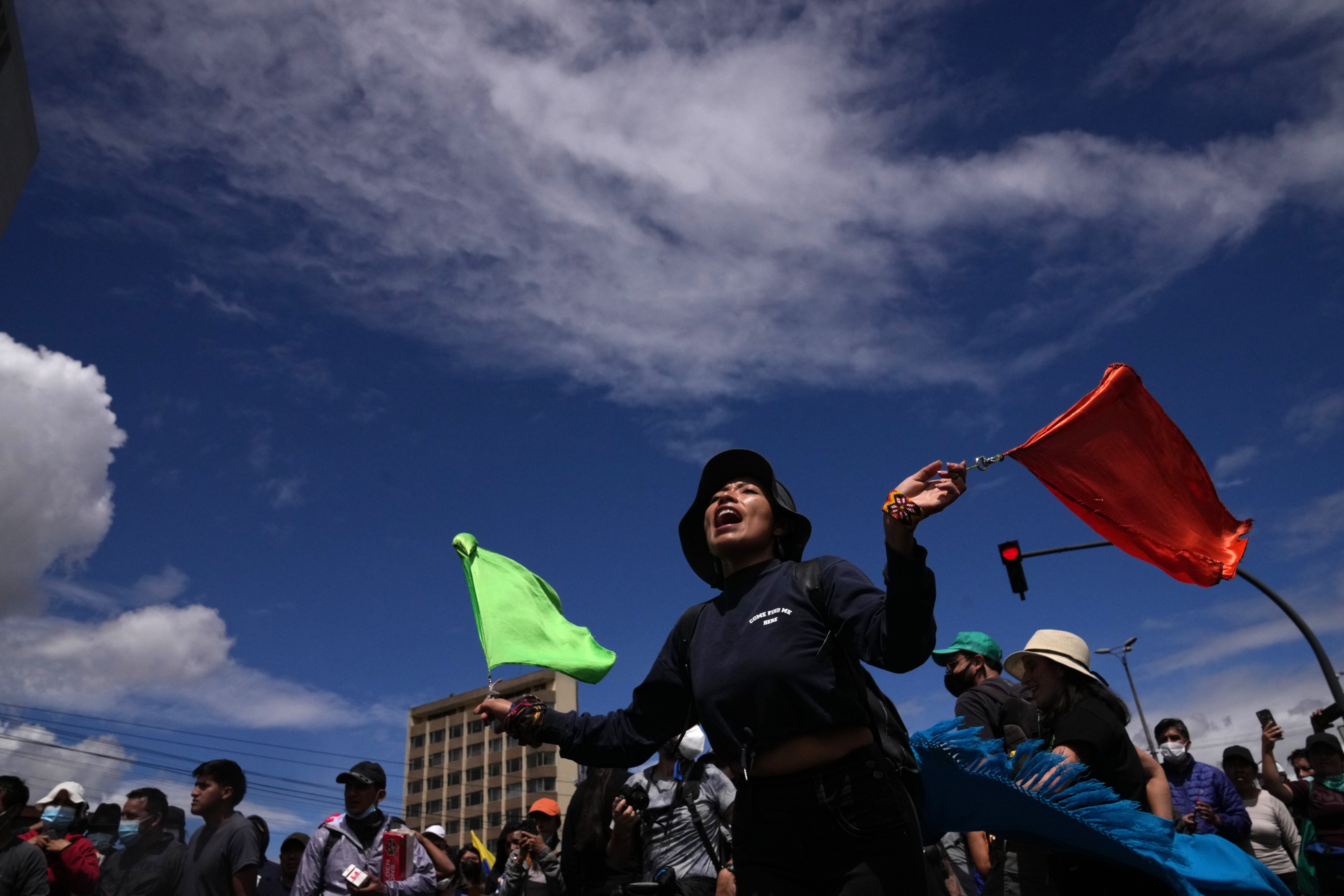 A students joins Indigenous women in a rally to show support for the recent protests and national strike against the government of President Guillermo Lasso