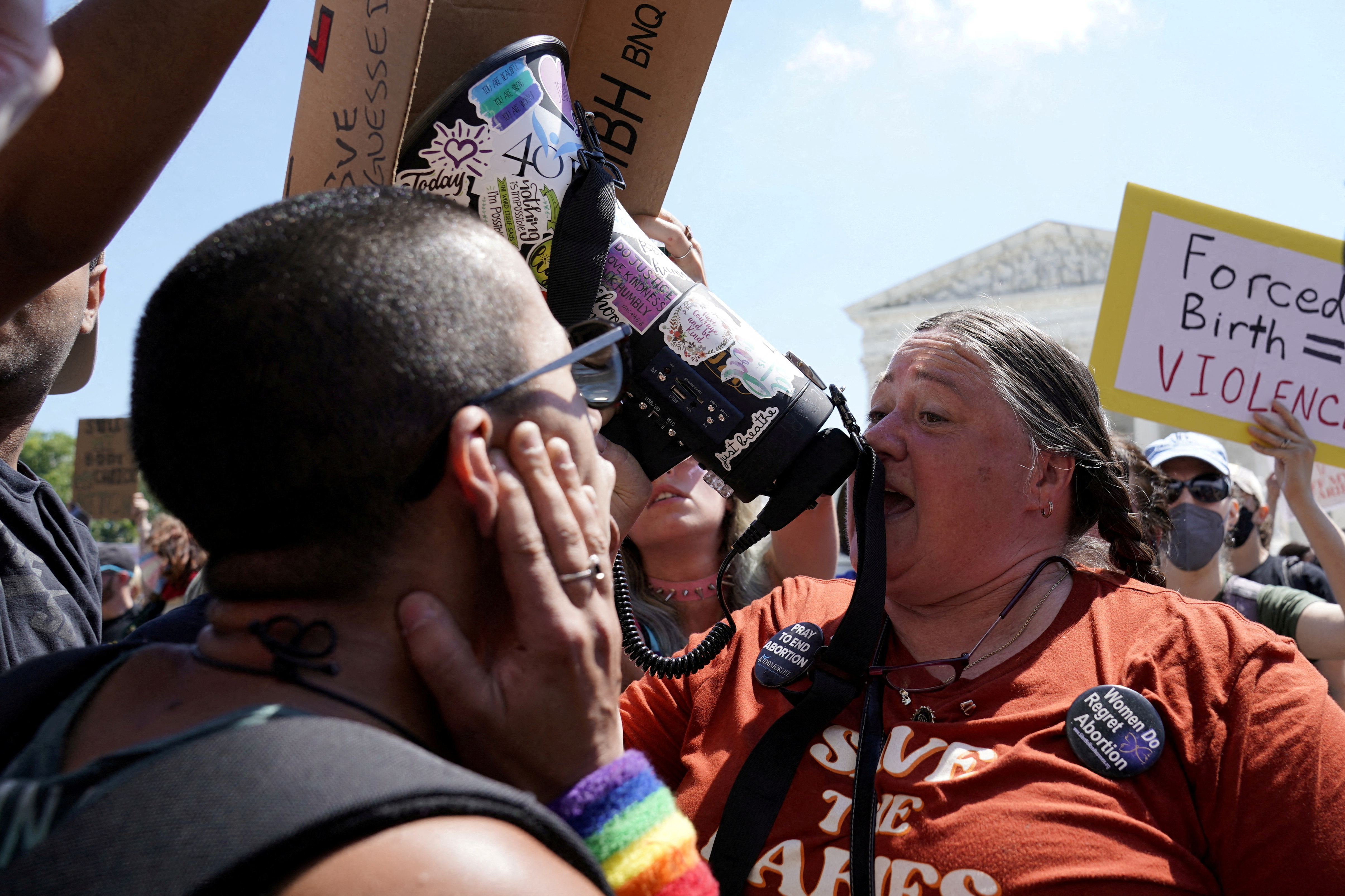 Anti-abortion demonstrators and abortion rights supporters protest outside the Supreme Court in Washington, DC on Saturday