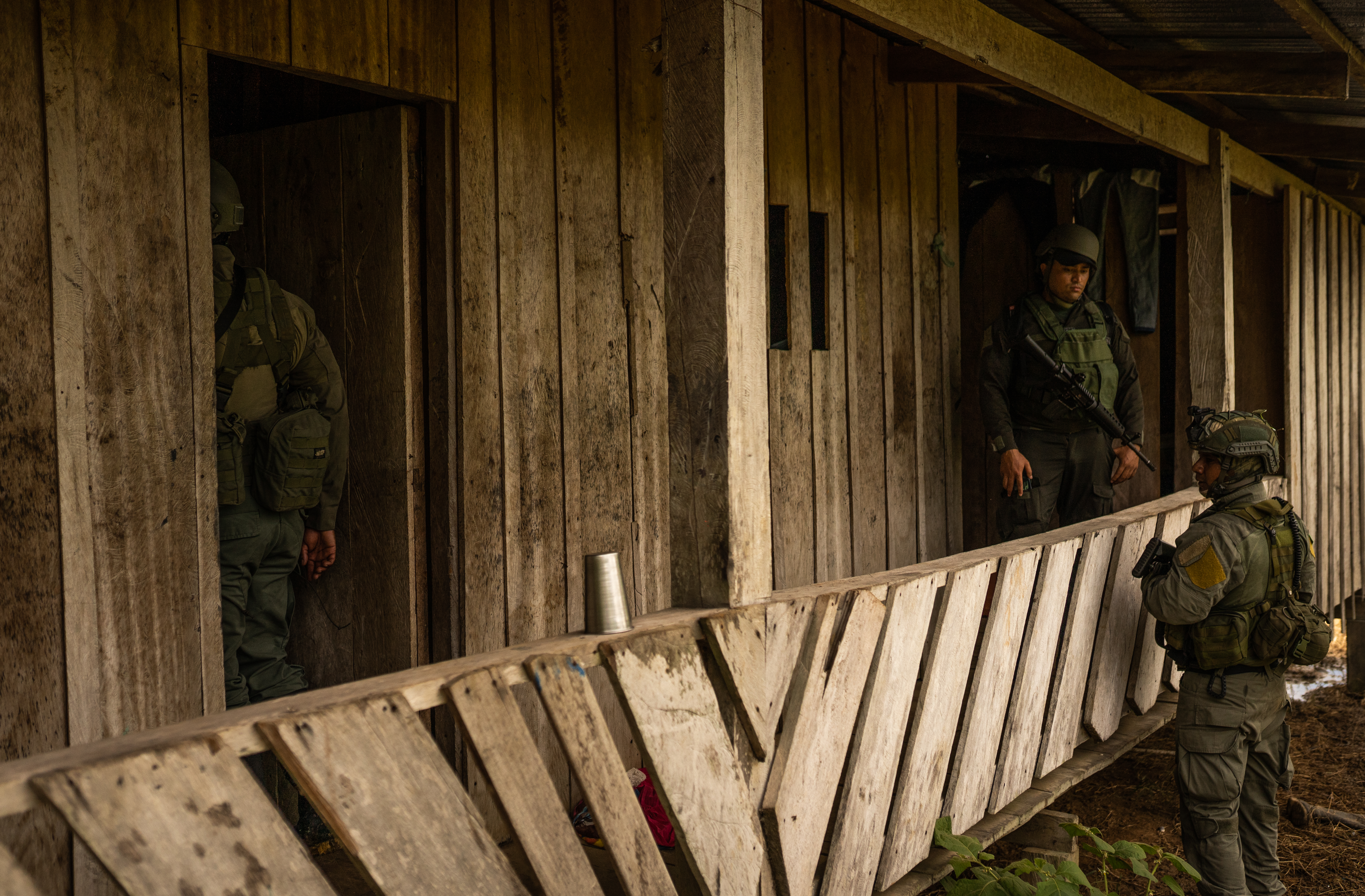 Police officers raid a house