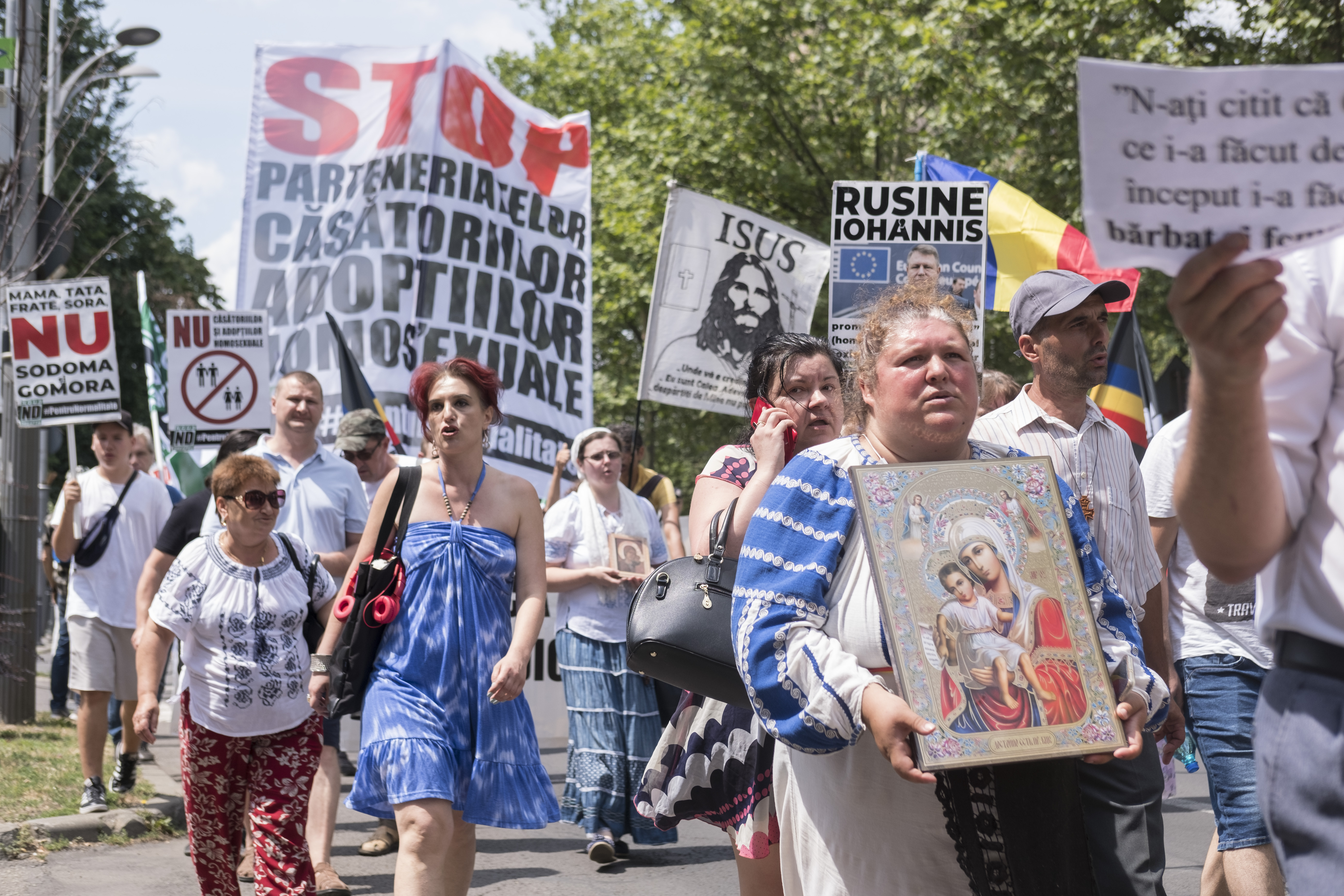 Around 200 people displaying anti LGBT rights banners and Christian Orthodox imagery