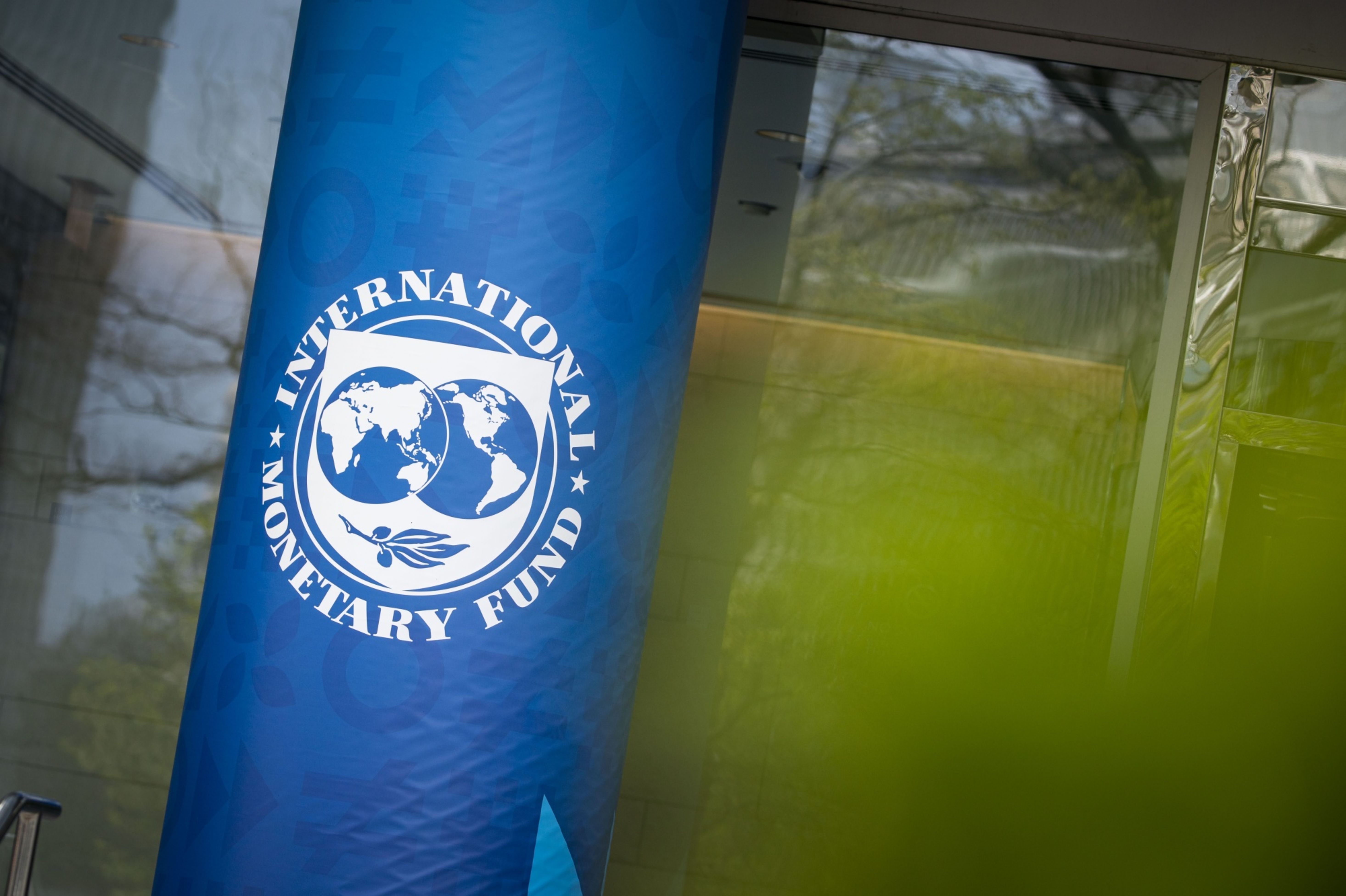Signage outside the International Monetary Fund (IMF) headquarters in Washington, DC, US