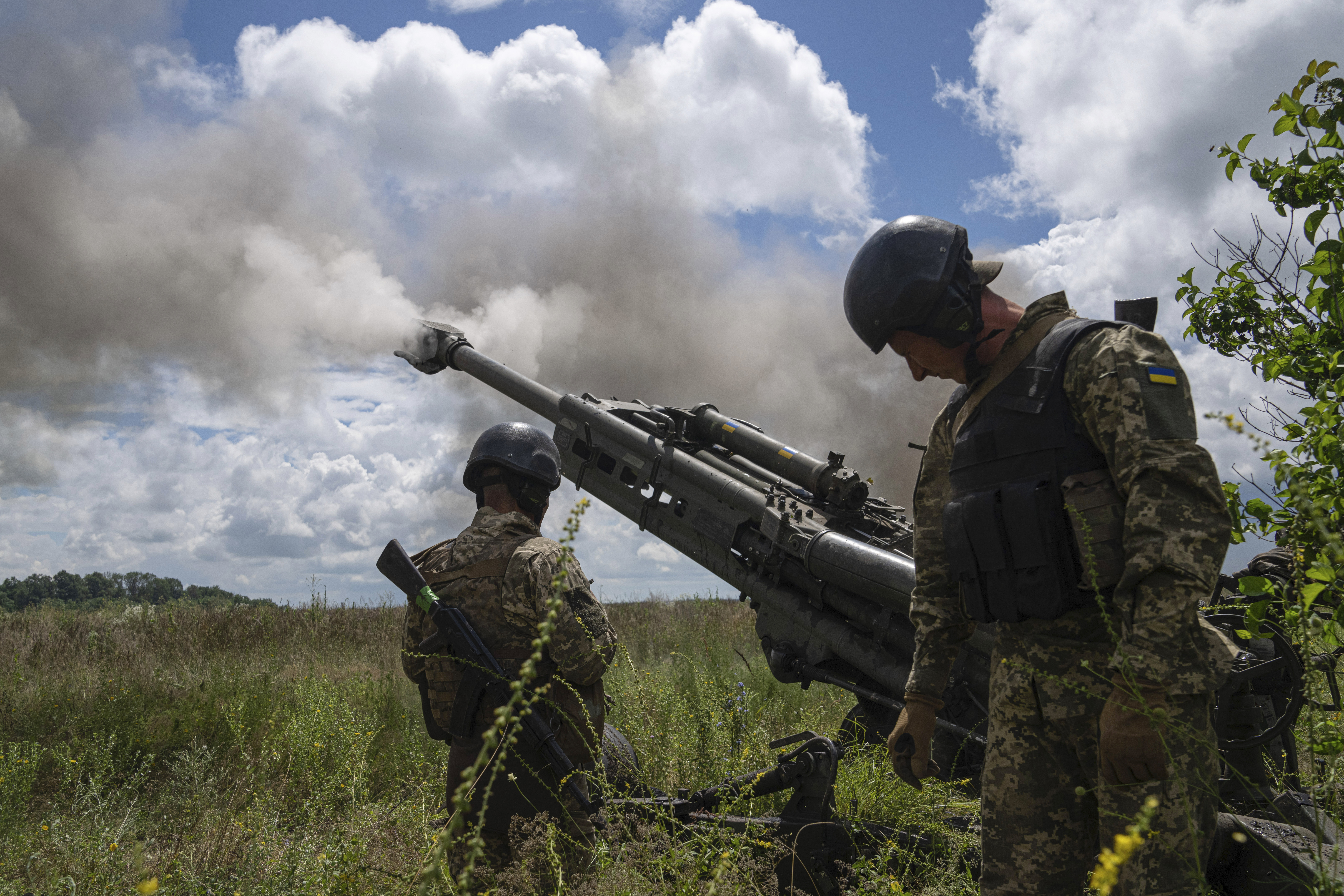Ukrainian servicemen fire at Russian positions from a U.S.- supplied M777 howitzer in Kharkiv region,