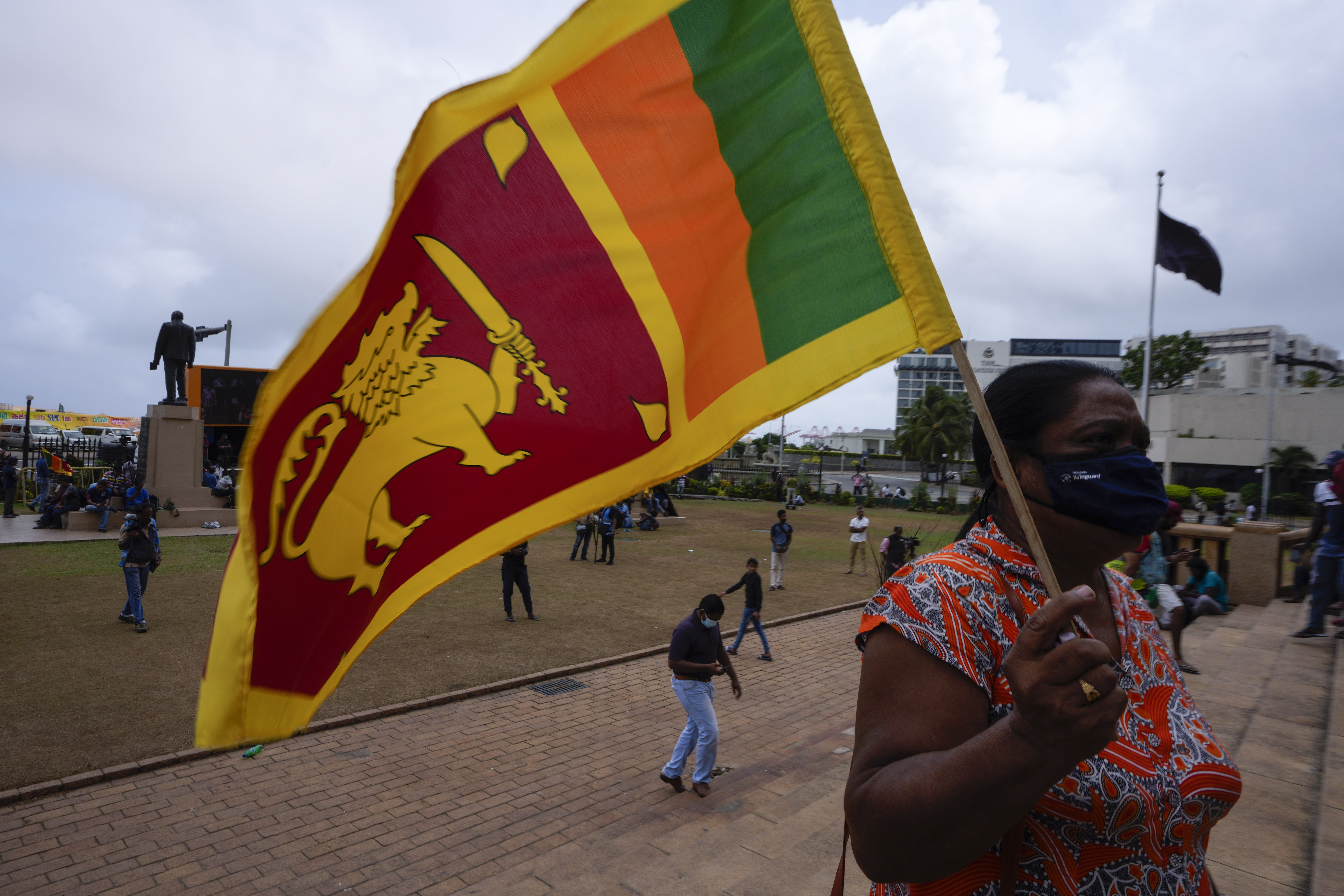 A protestor holds Sri Lankan flag outside president's office in Colombo, Sri Lanka