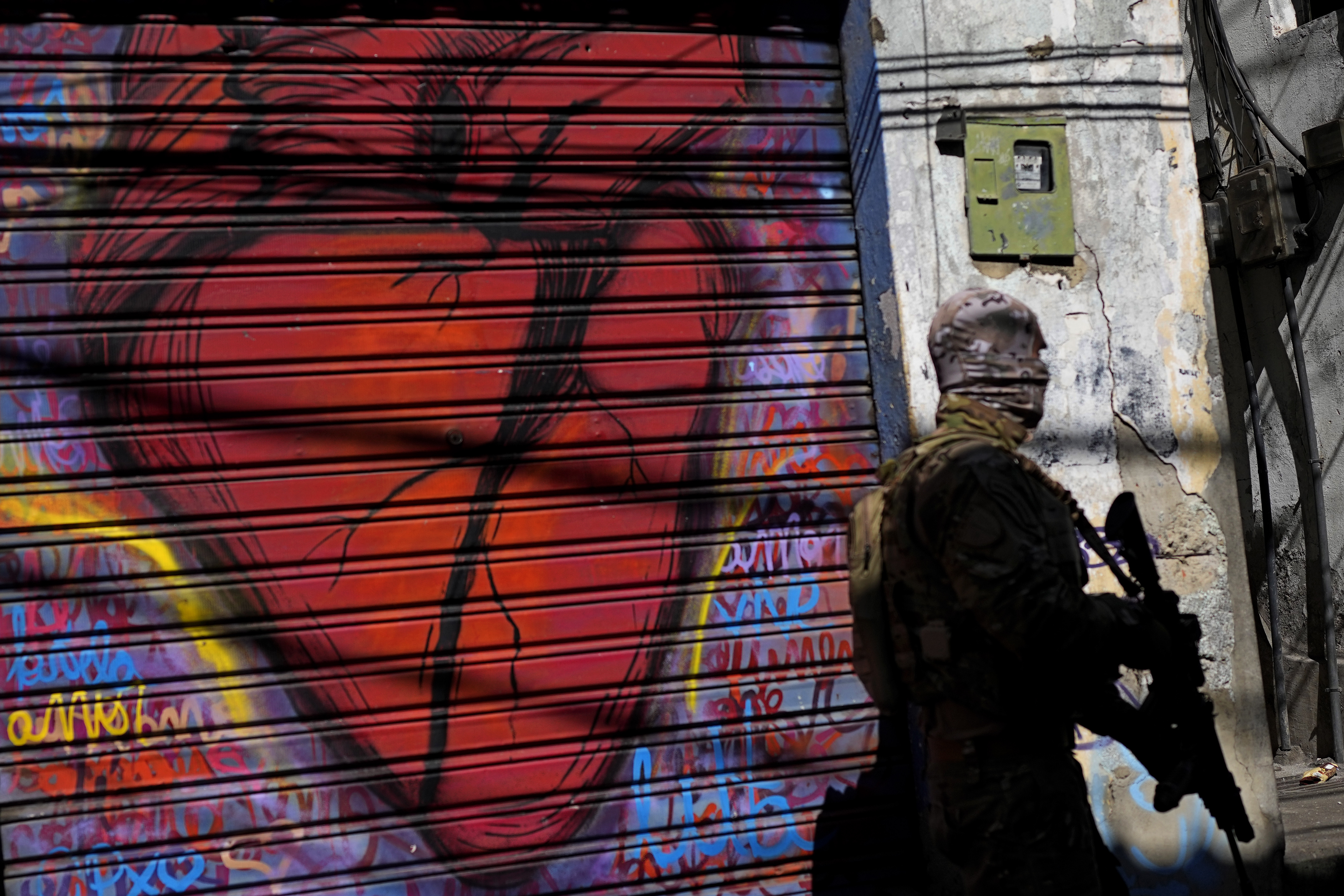 A police officer takes part in an operation in Rio's Complexo do Alemao in Brazil.