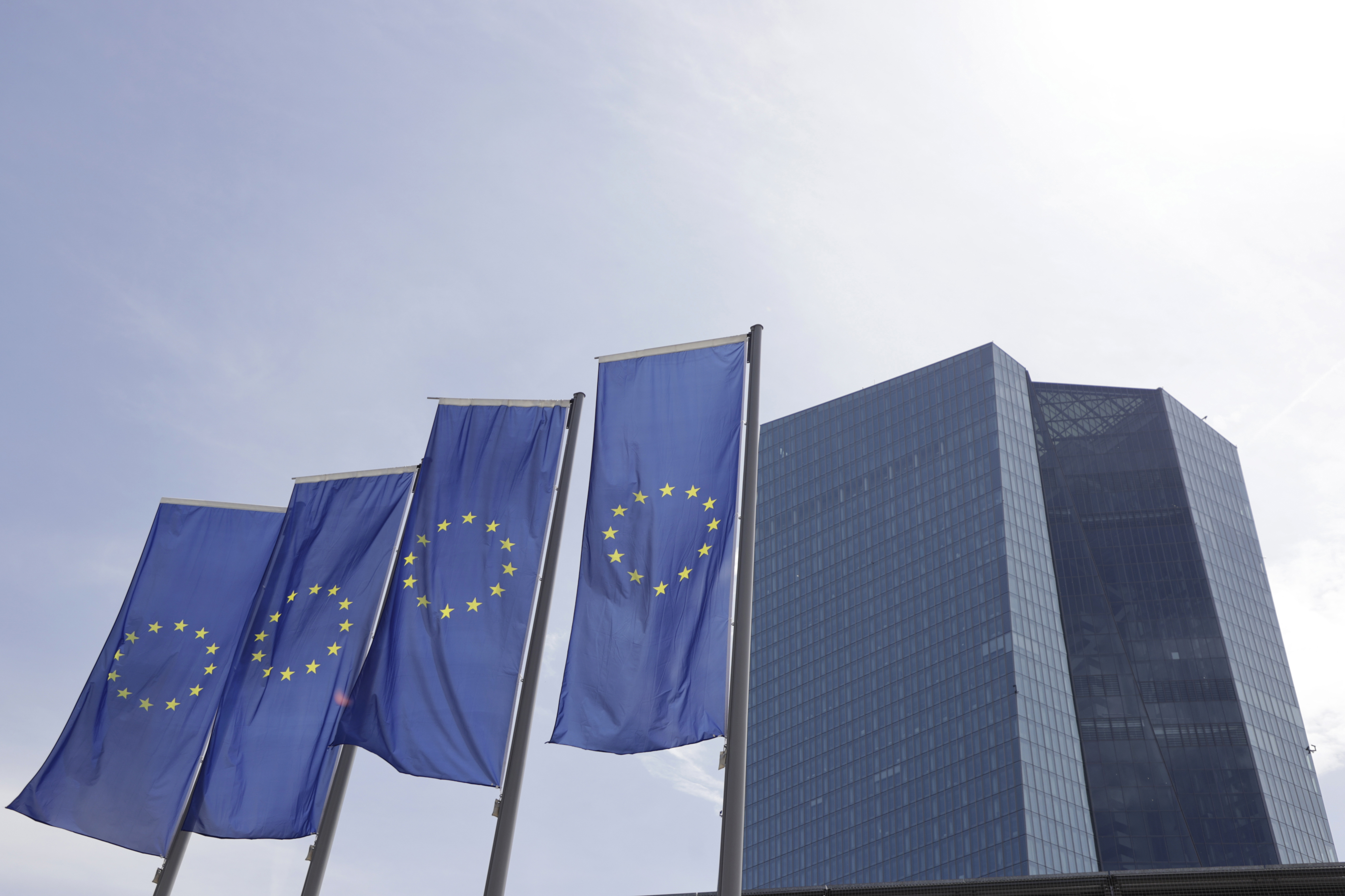 Flags of the European Union (EU) outside the headquarters of the European Central Bank (ECB) in Frankfurt, Germany, on Monday, May 23, 2022. While ECB policy makers have increasingly coalesced around the prospect of a first hike at their July 21 meeting in recent weeks, they have barely mentioned the possibility of a more aggressive half-point move such as the US Federal Reserve delivered this month.