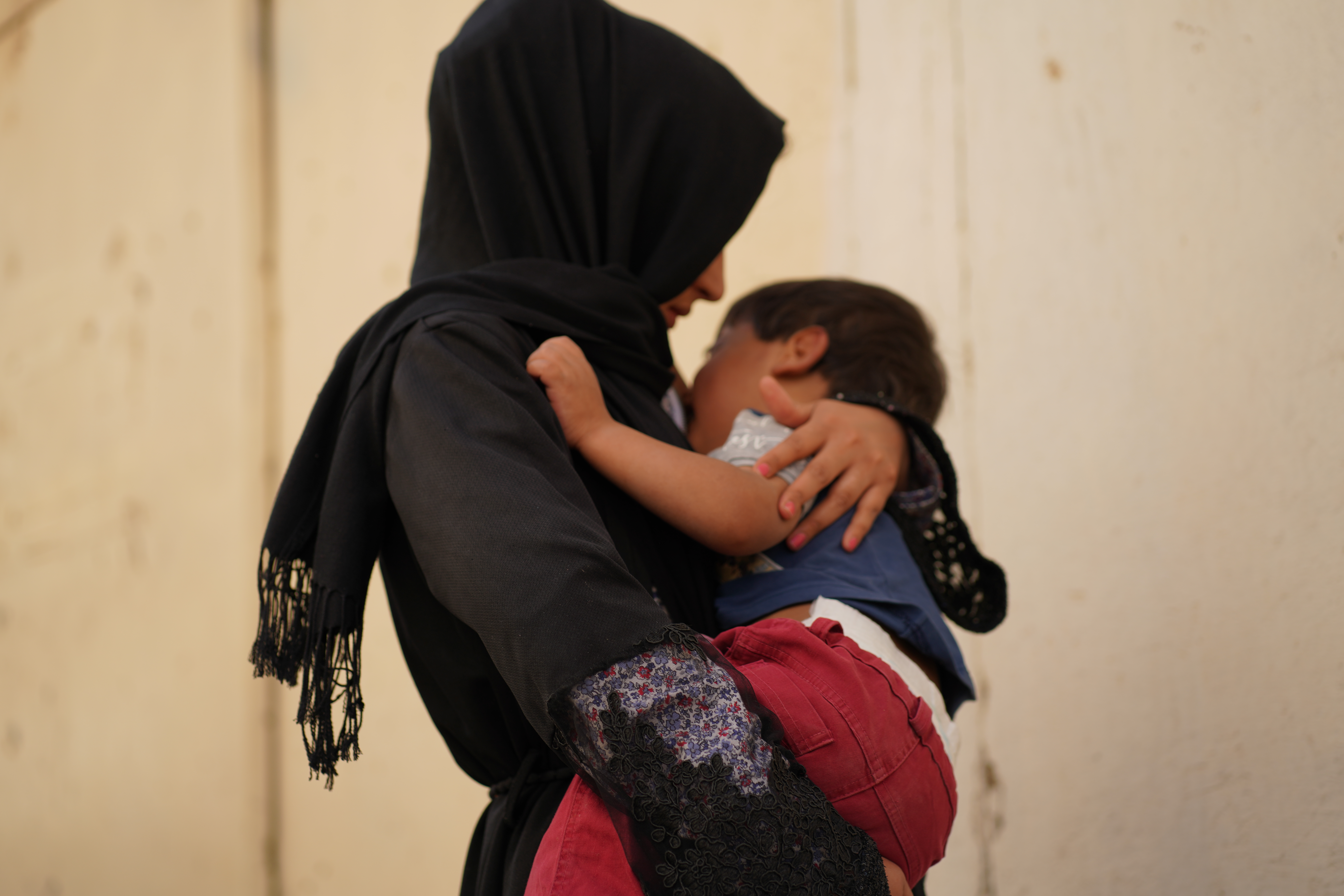 A victim of trafficking, with her son