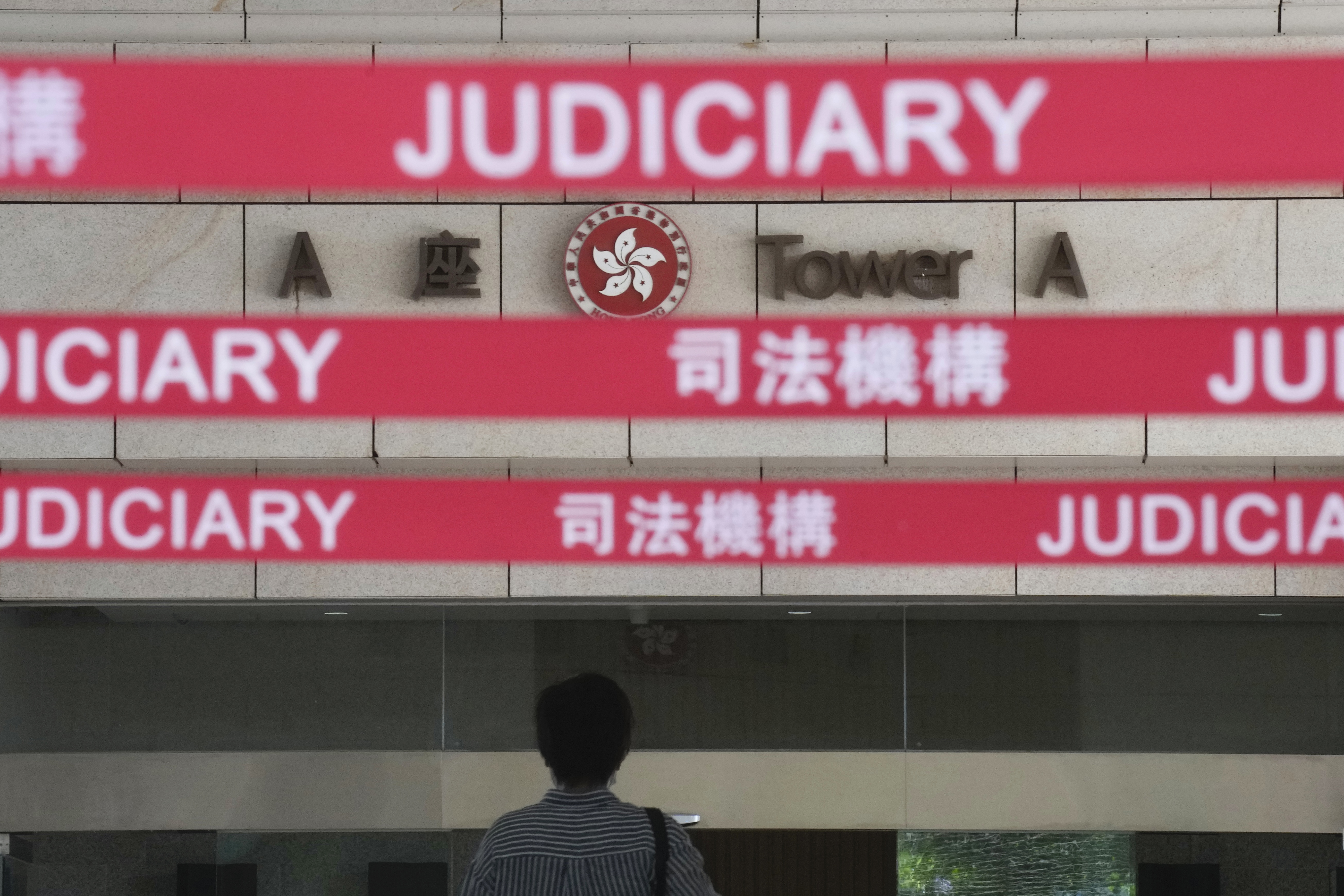 A man walks towards the main entrance to a local court in Hong Kong, July 22, 2021