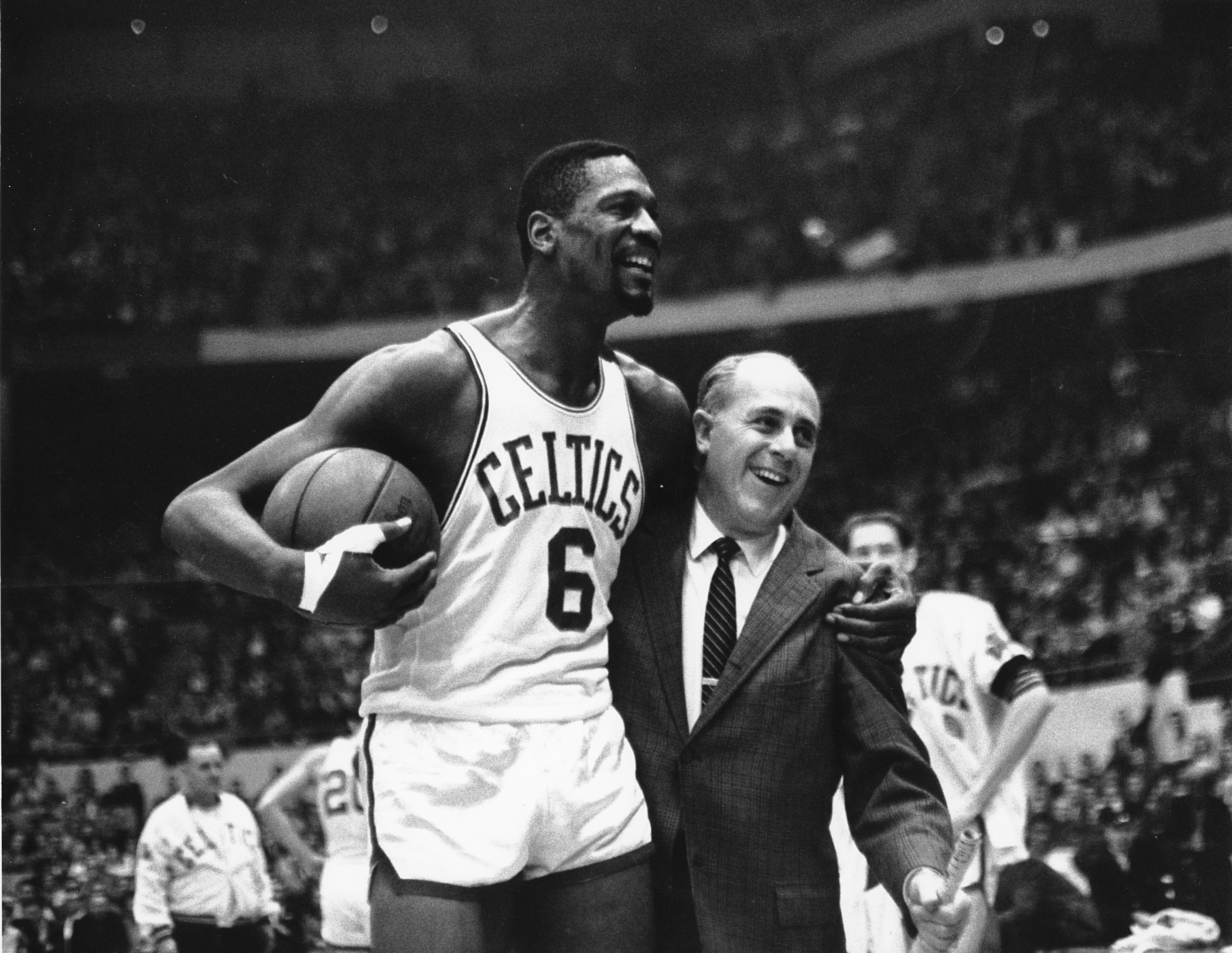 Bill Russell with his arm around his coach