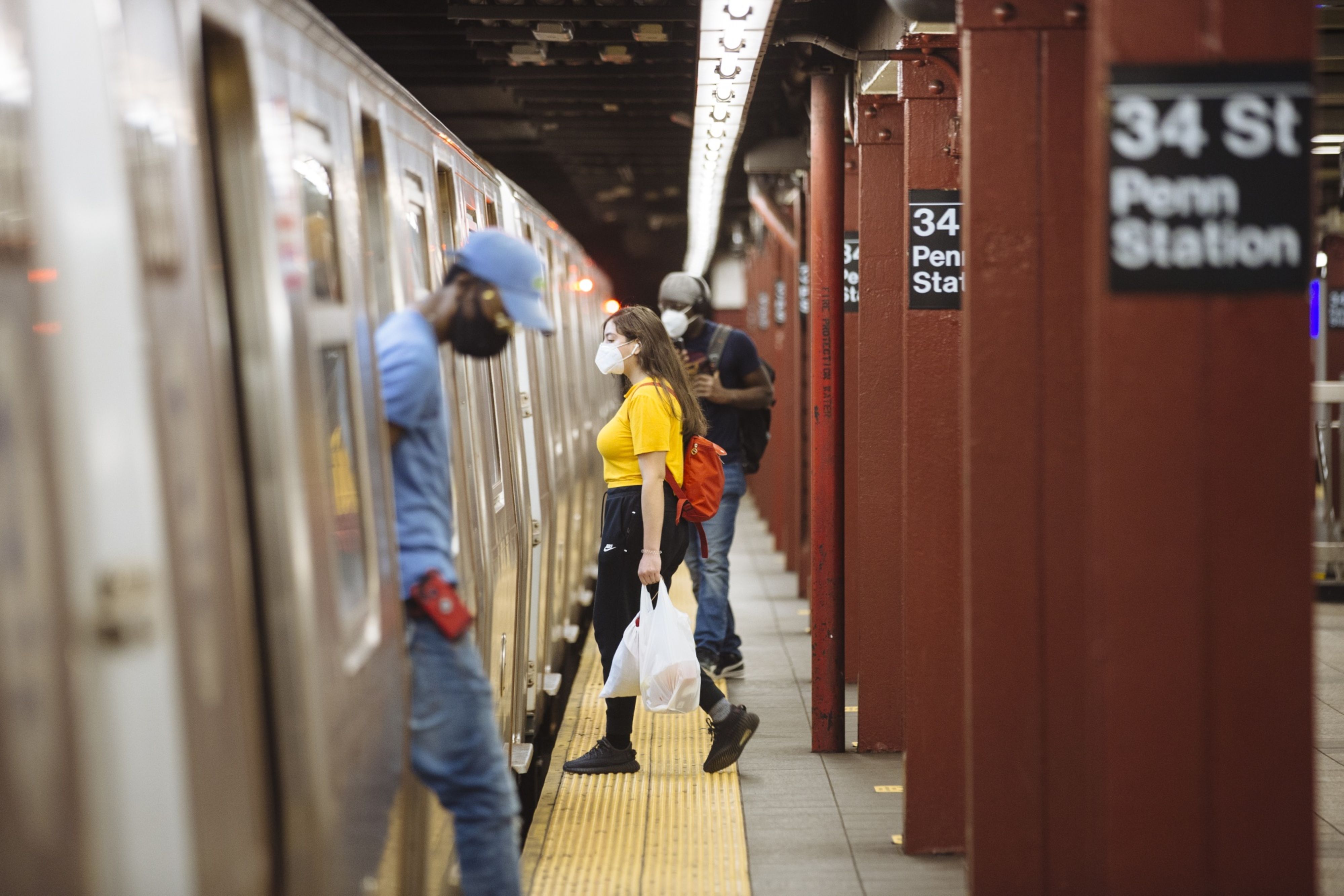 Commuters during rush hour at the 34 Street-Penn Station subway station in New York