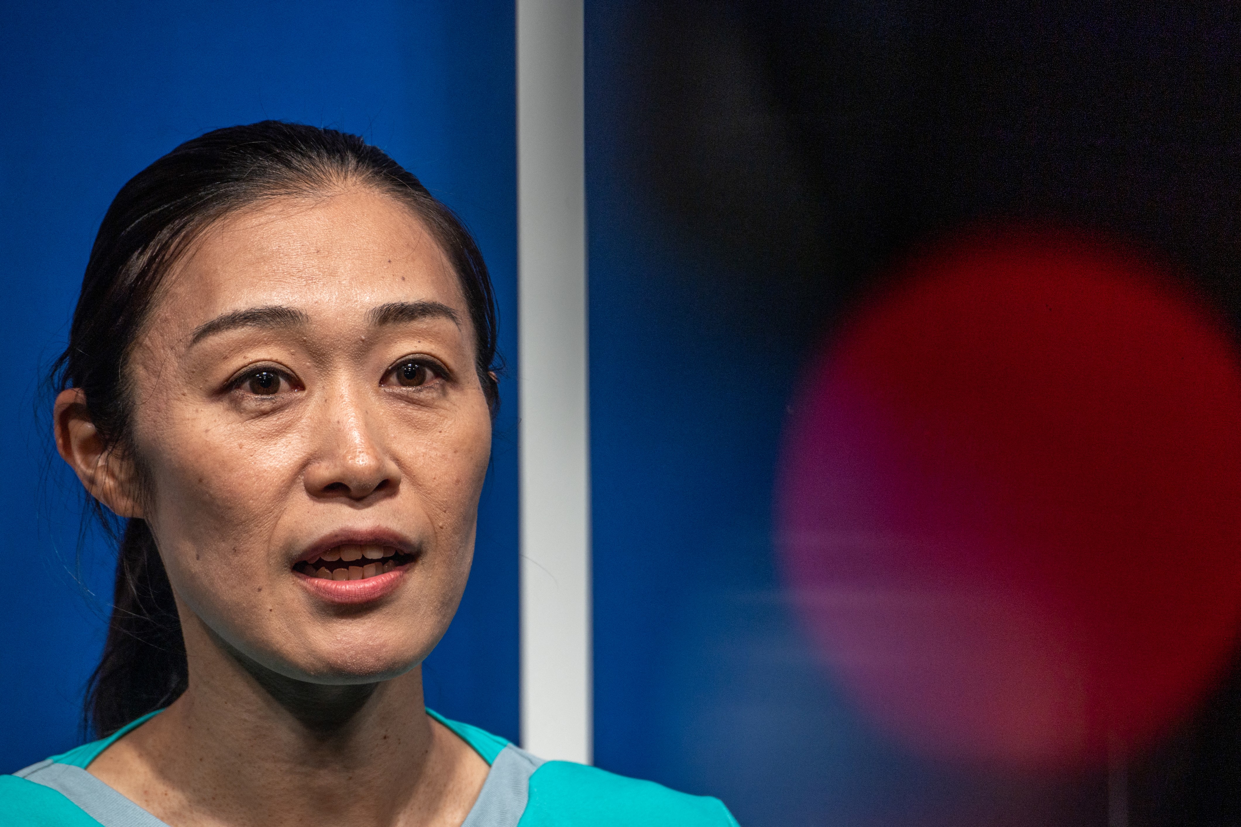 Japan's first female professional referee Yoshimi Yamashita speaks during a press conference in Japan football museum in Tokyo on August 1, 2022. (Photo by Philip FONG / AFP)