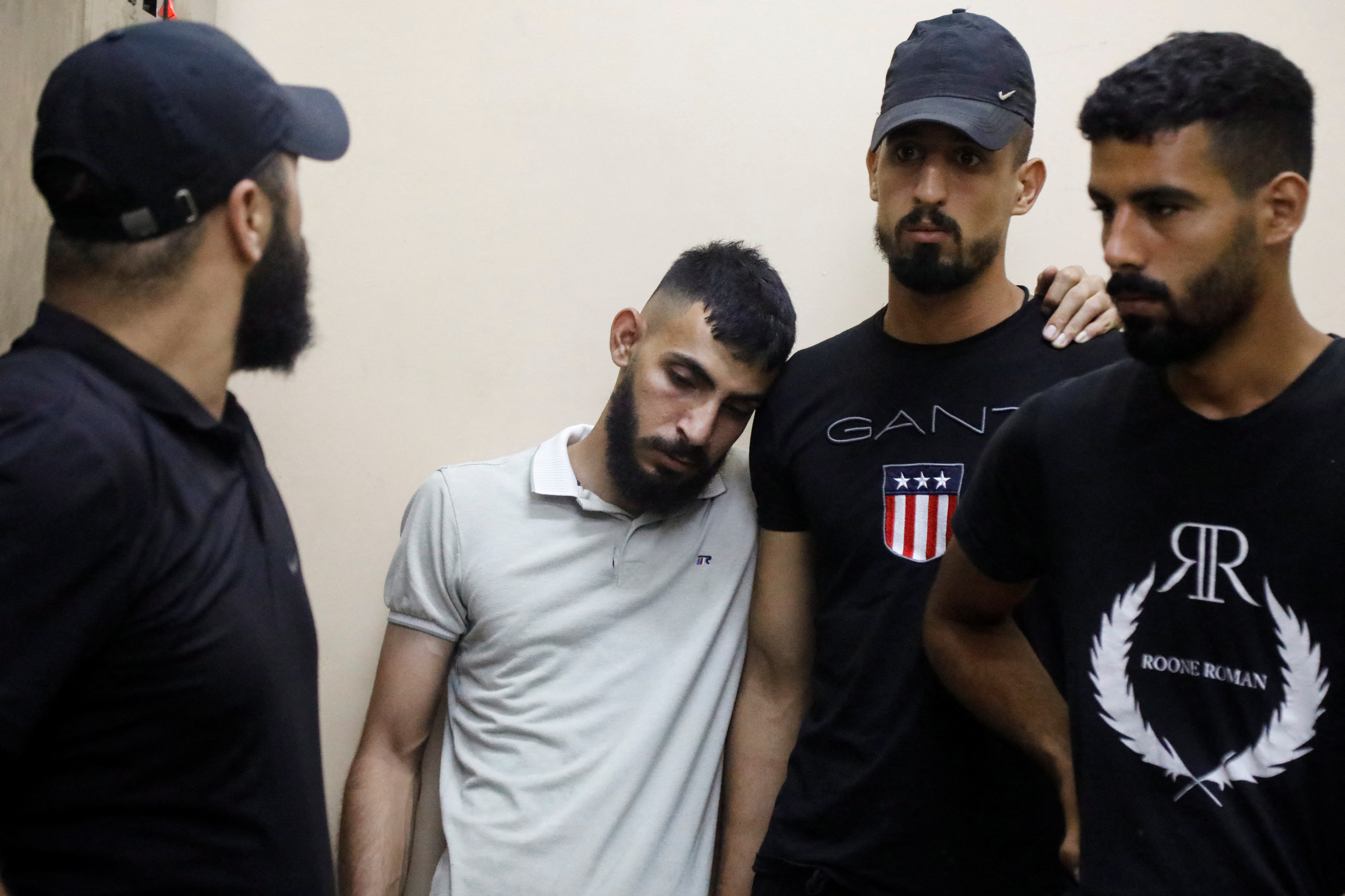 Relatives and friends react after Israeli forces killed Palestinian Younes Tayeh \