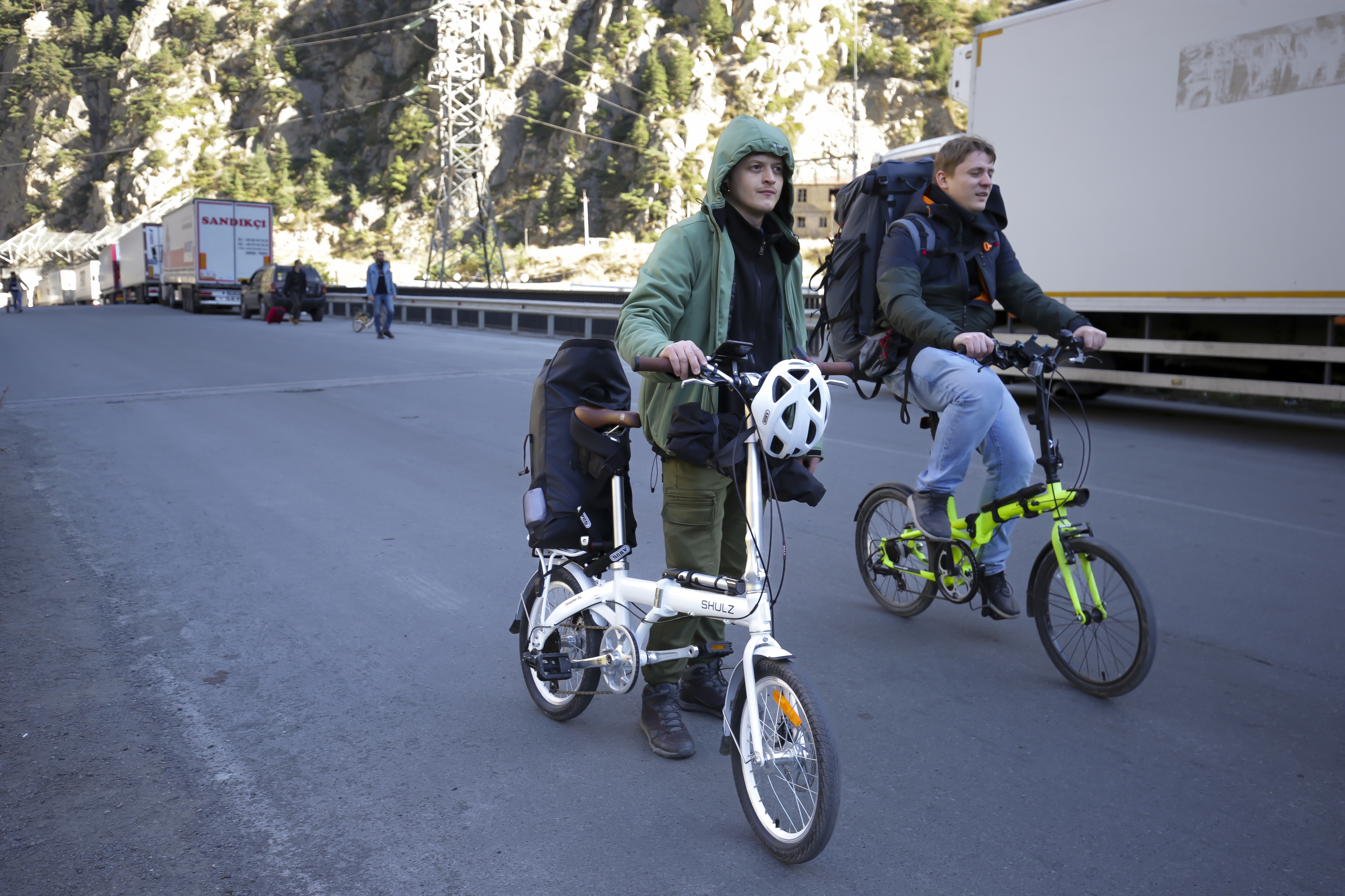 People riding bikes across the border.