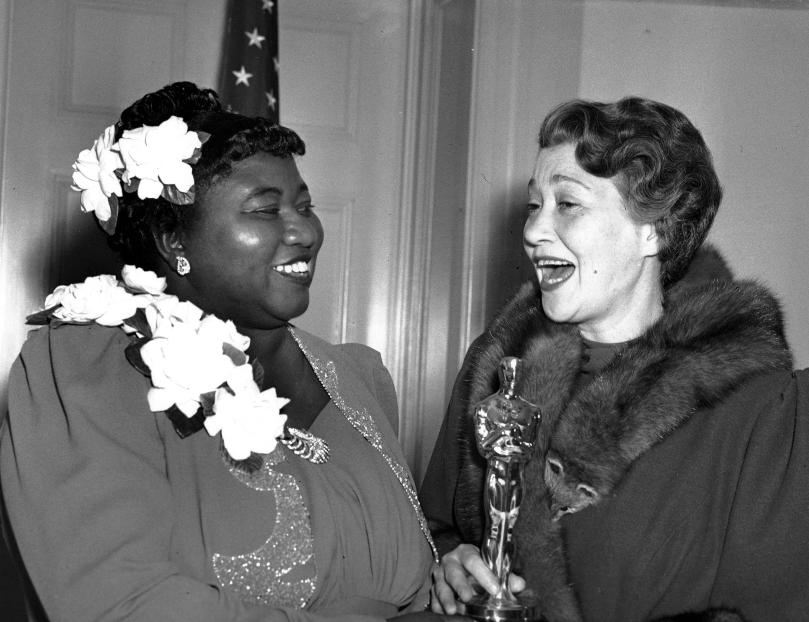 Hattie McDaniel, left, was given the Motion Picture Academy award for the best performance of an actress in a supporting role in 1939 for her work as "Mammy" in the film version of "Gone With the Wind" on Feb. 29, 1940 in Los Angeles, Calif. The presentation of the award was given by actress Fay Bainter, right. (AP Photo)