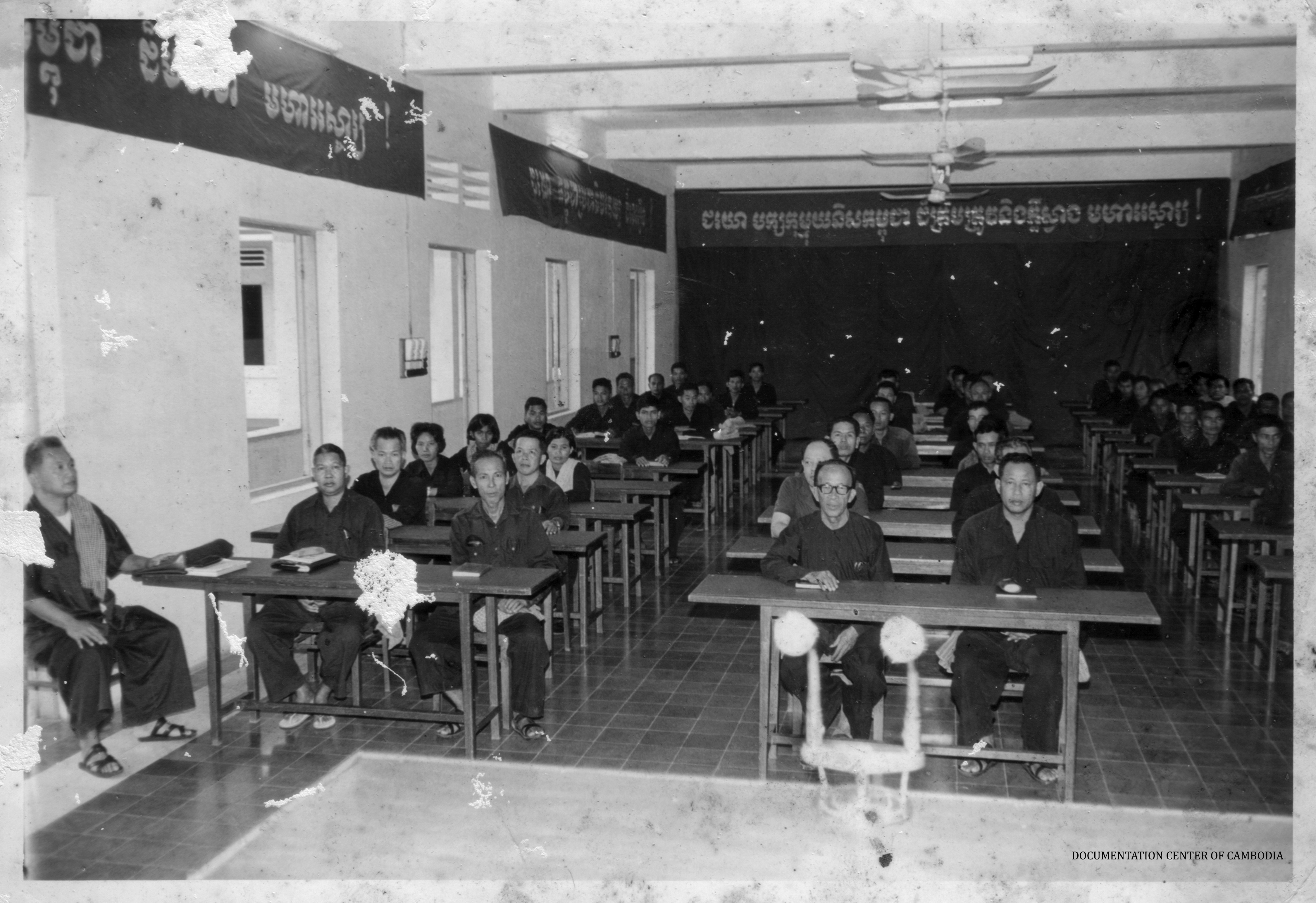 In this classroom setting sit "Brother No.2" Nuon Chea; Vorn Vet, the regime's minister of commerce; Head of State Khieu Samphan; Ta Mok, brutal military commander and secretary of the regime's Southwest Zone; Ke Pauk, secretary of the Northern Zone; Chou Chet, secretary of the Western Zone, and Ieng Sary, the regime's minister of foreign affairs.