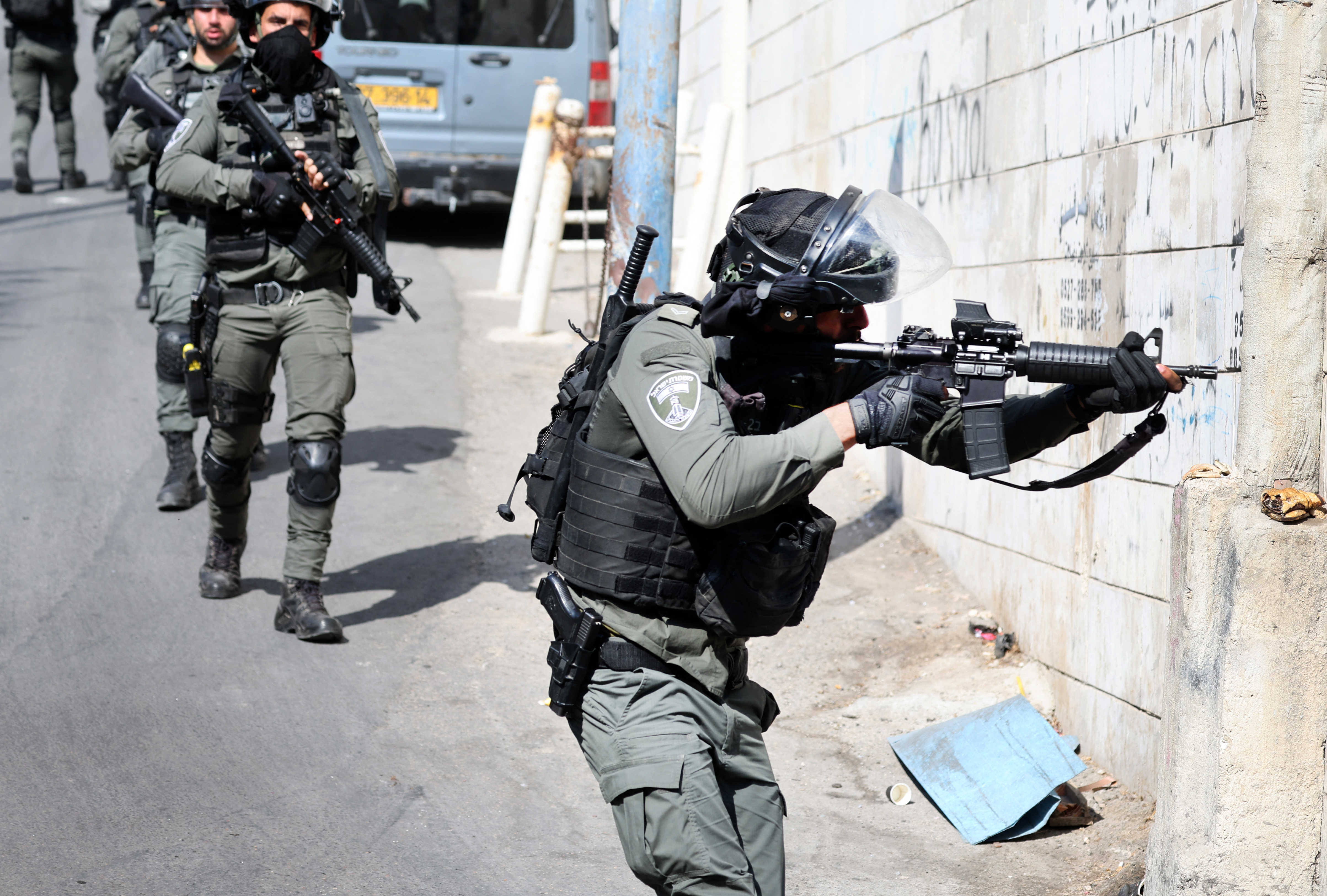 Israeli security forces conduct a search the Palestinian Shuafat refugee camp