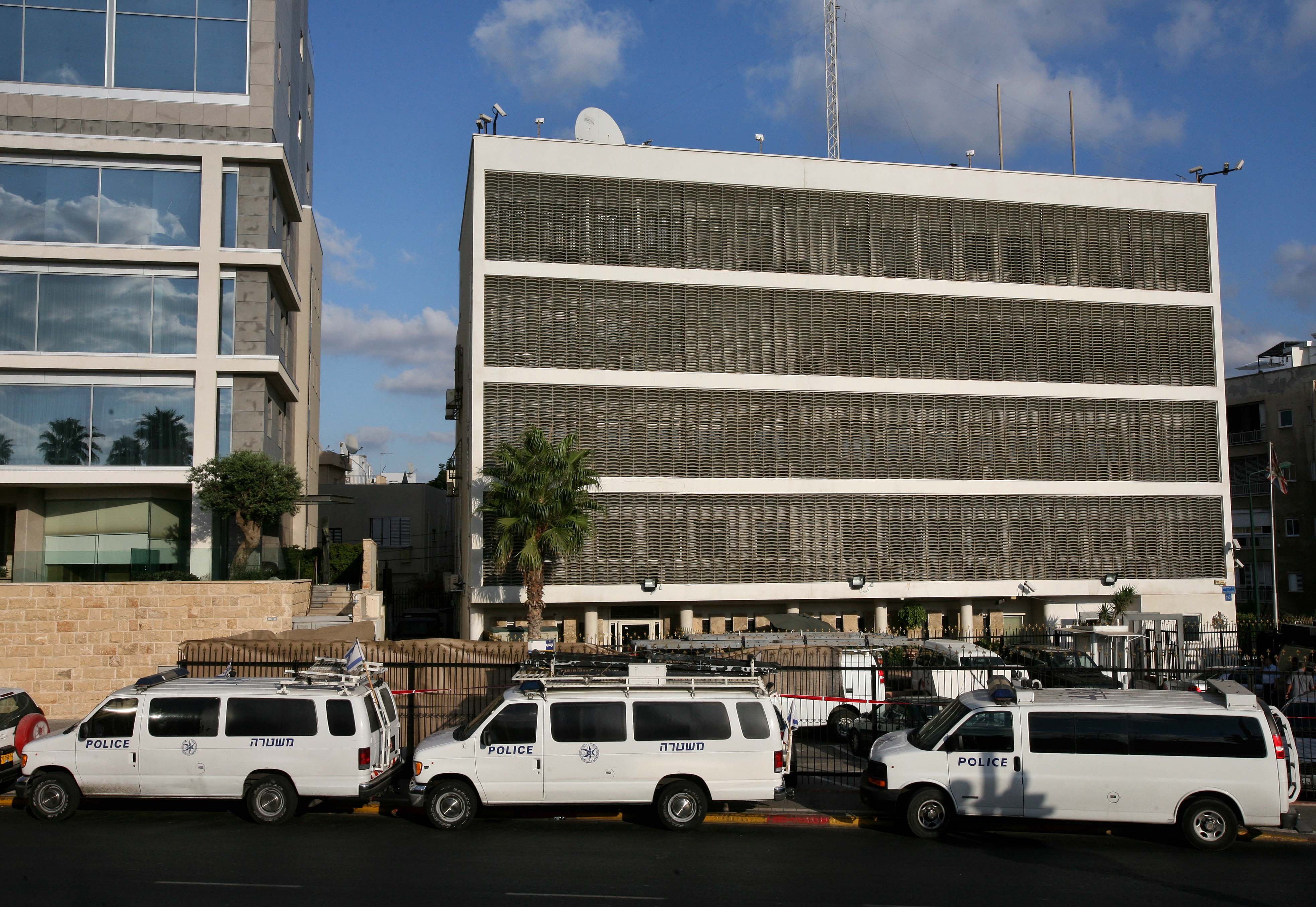 Israeli police vans are seen parked in front of the British embassy