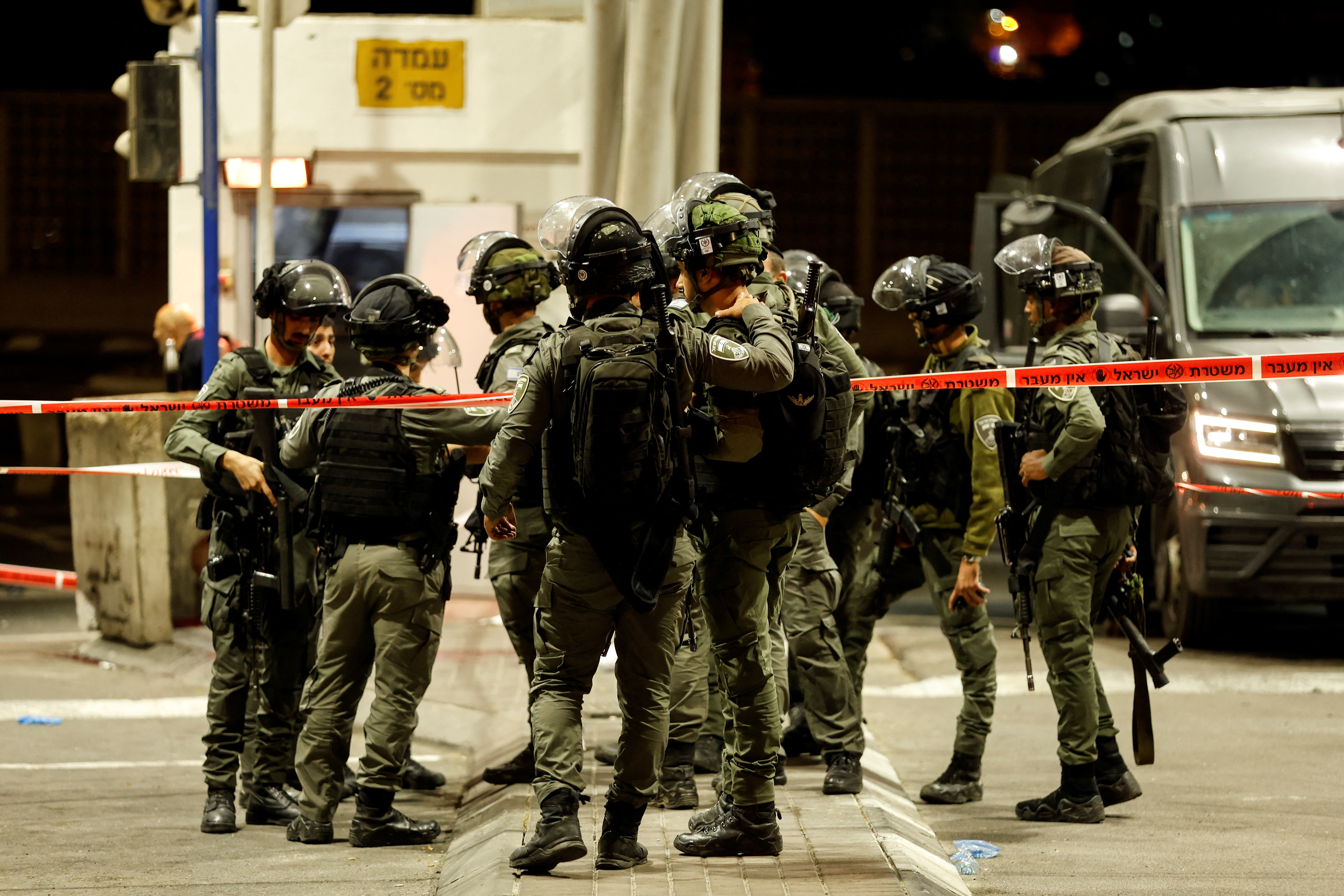 Israeli security forces gather following a shooting incident at a check point in East Jerusalem, Israeli police said October 8, 2022.