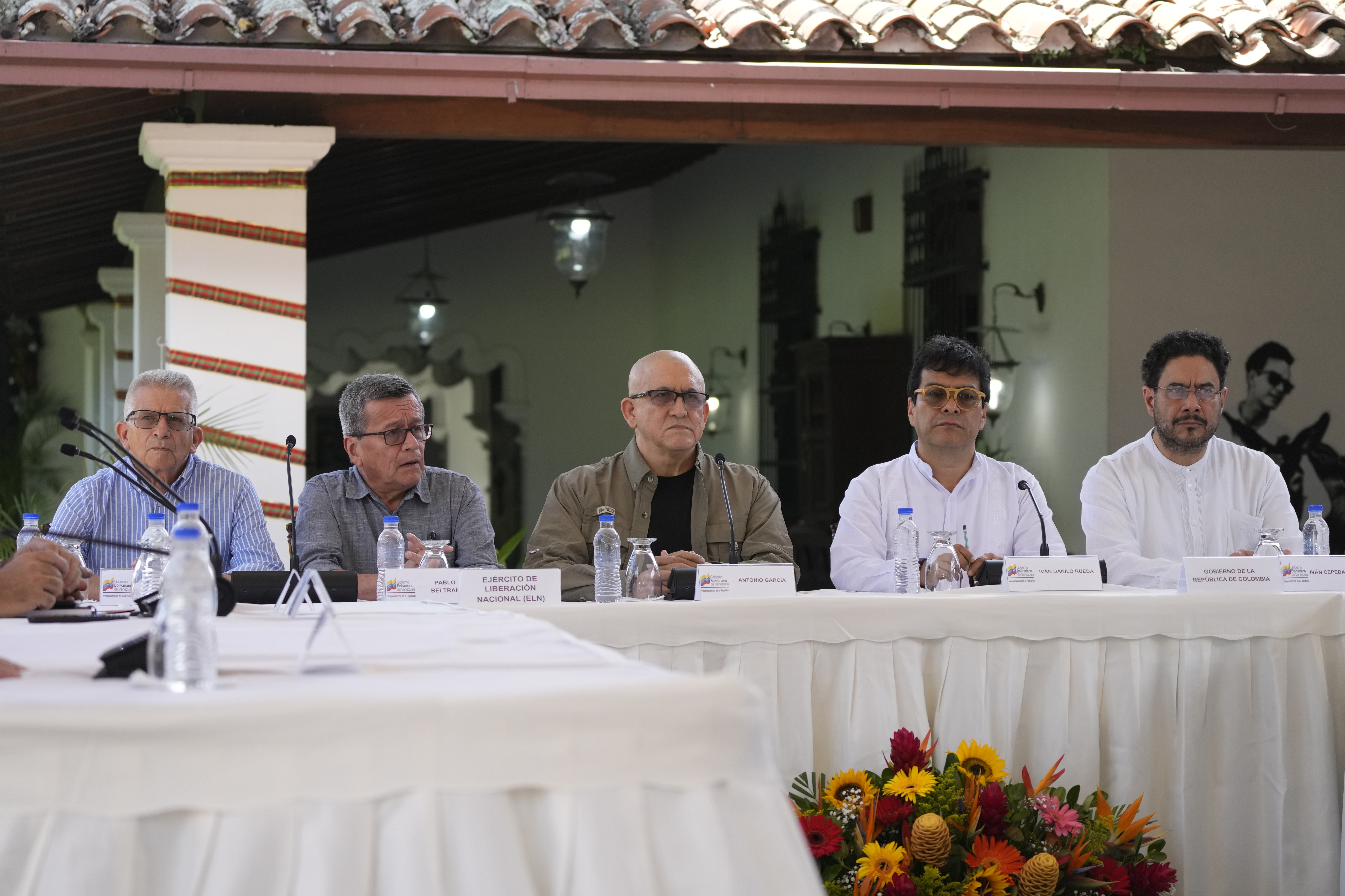 Members of the Colombian National Liberation Army with a delegation from the Colombian government in talks to revive a peace initiative.