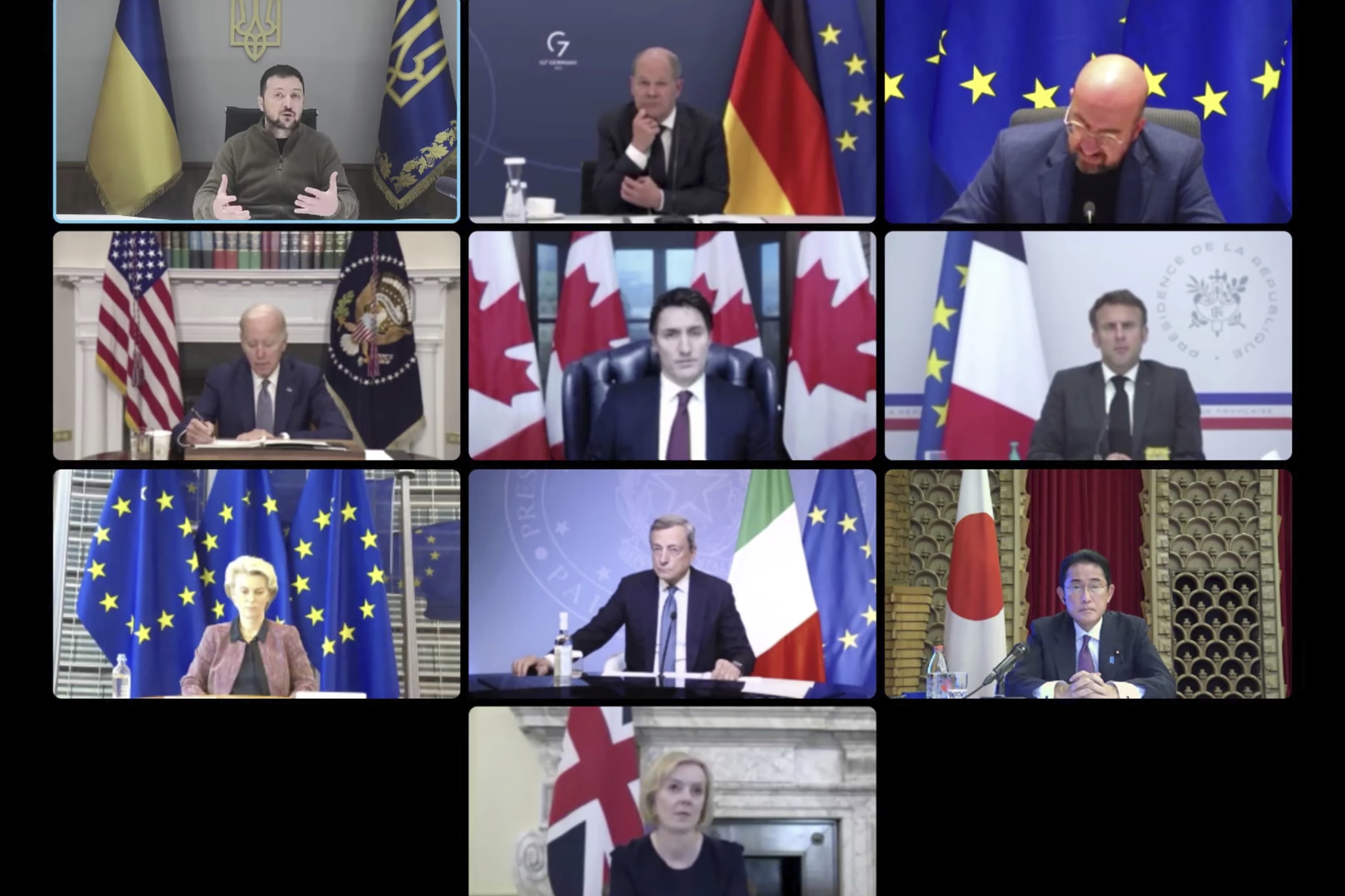 Ukrainian President Volodymyr Zelenskyy appears on a screen with German Chancellor Olaf Scholz, European Council President Charles Michel, US President Joe Biden, Canadian PM Justin Trudeau, French President Emmanuel Macron, EU Chief Ursula von der Leyen, Italian PM Mario Draghi, Japanese PM Fumio Kishida and UK PM Liz Truss