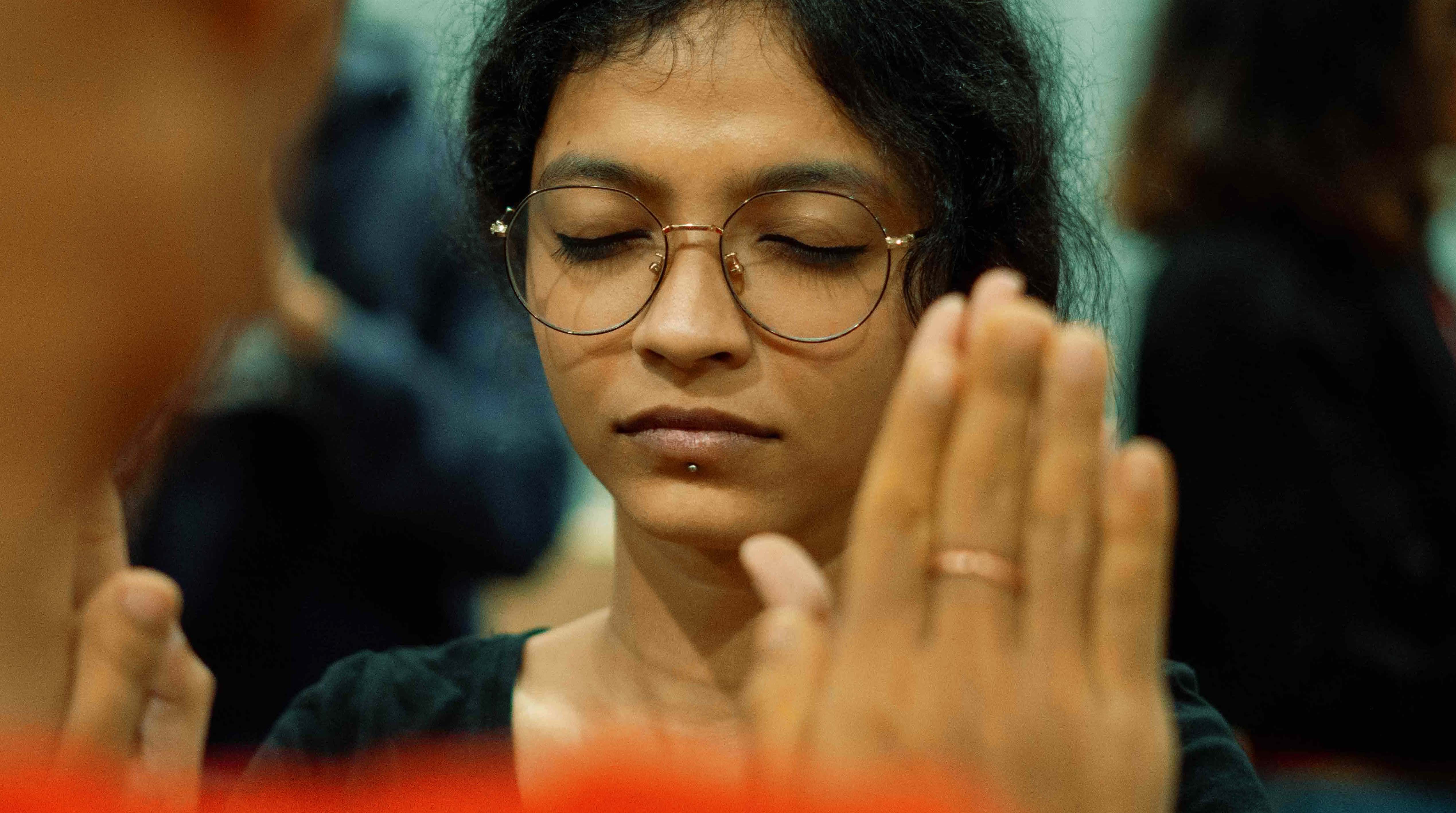 A photo of a woman with her eyes closed