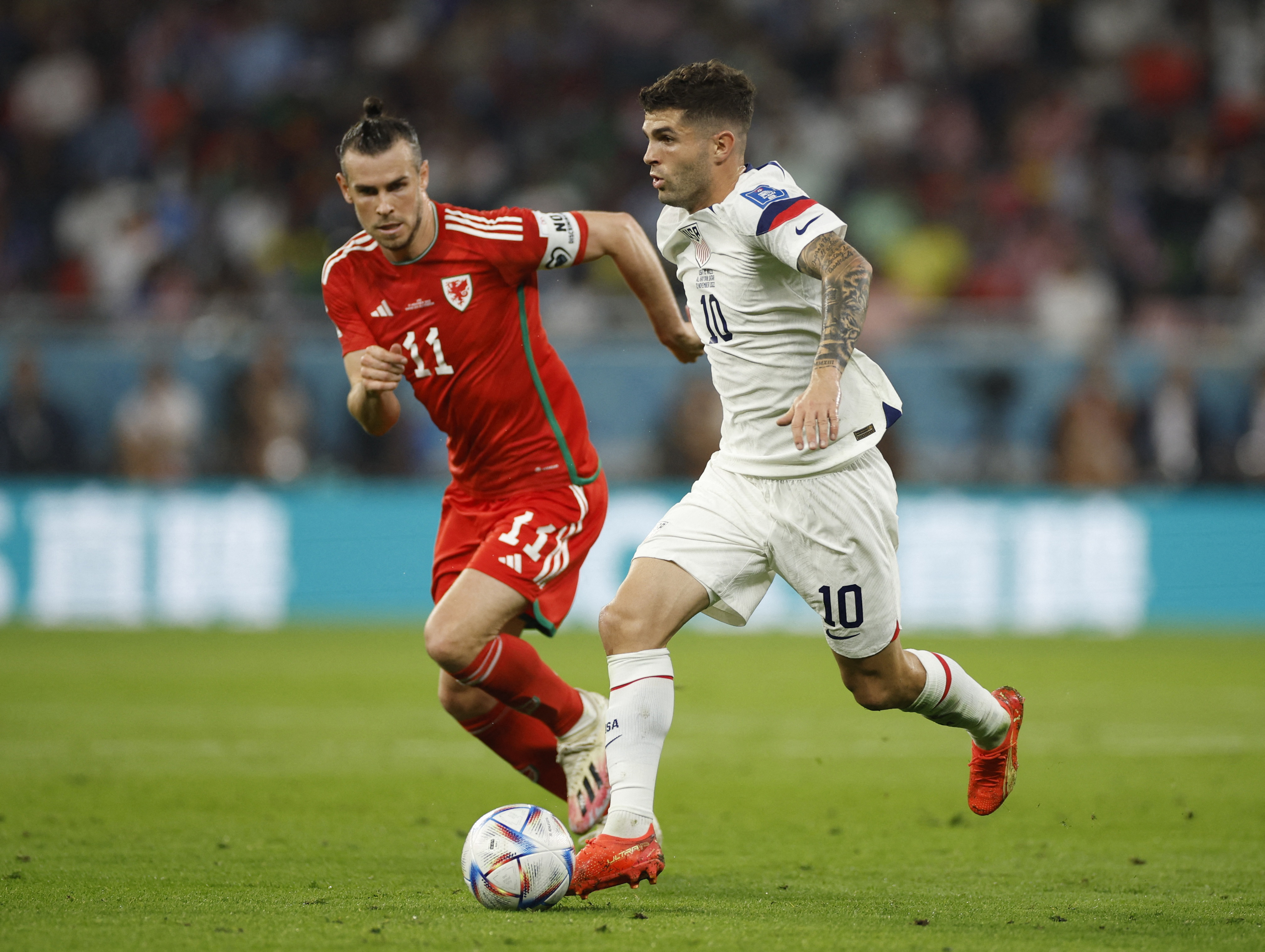 Wales' Gareth Bale in action with Christian Pulisic of the U.S.