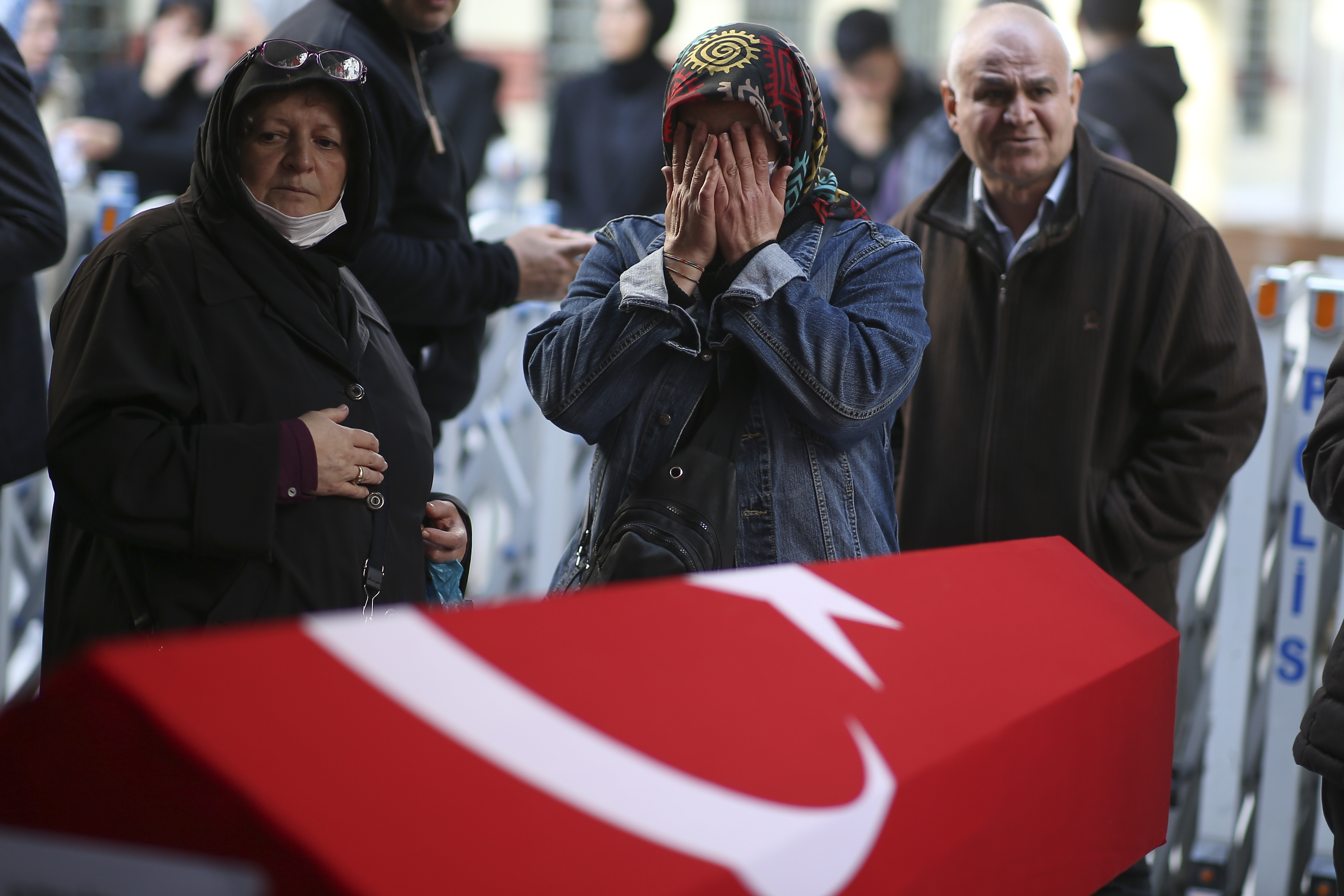 Relatives and friends of Arzu Ozsoy and her 15-year-old daughter Yagmur Ucar, who died in Sunday's explosion