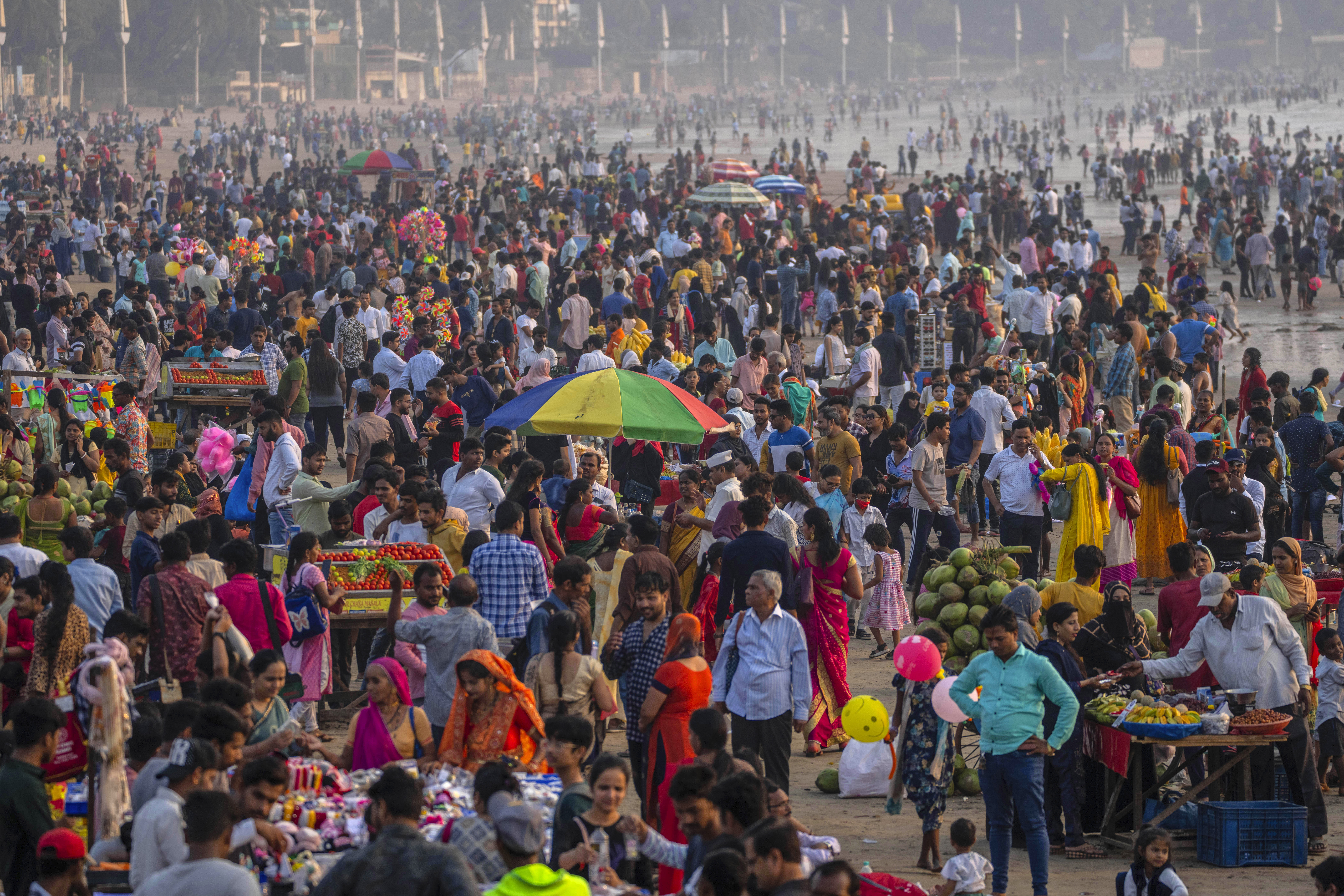 People crowd at the Juhu beach on the Arabian Sea
