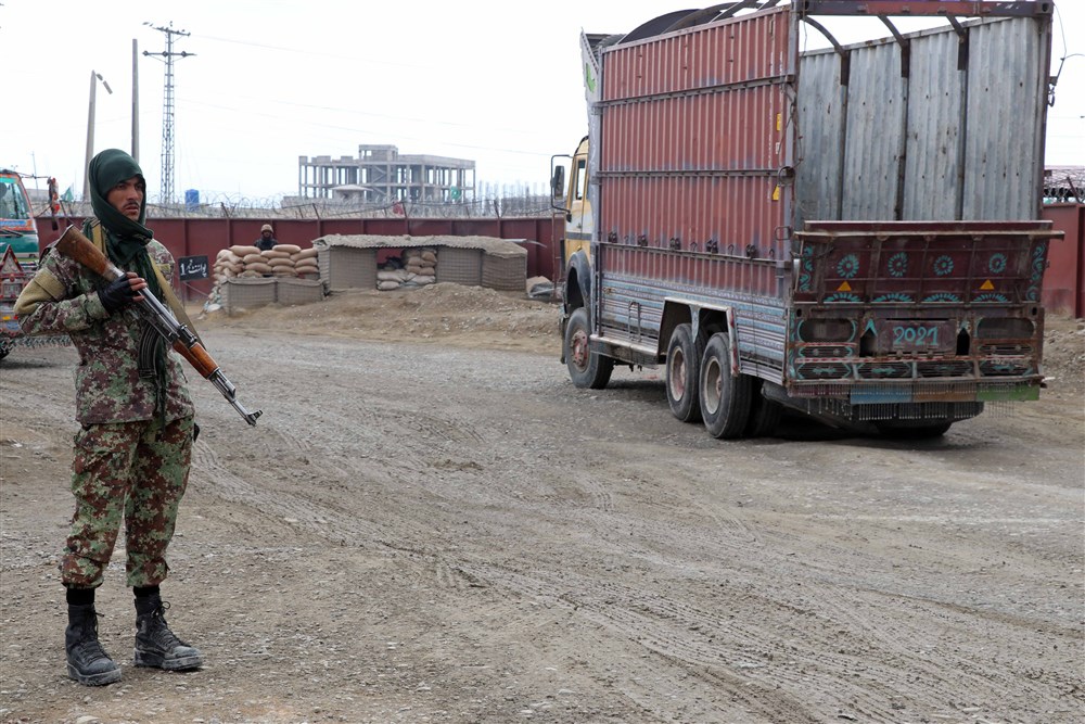A Taliban stands guard at Afghanistan-Pakistan border in Spin Boldak