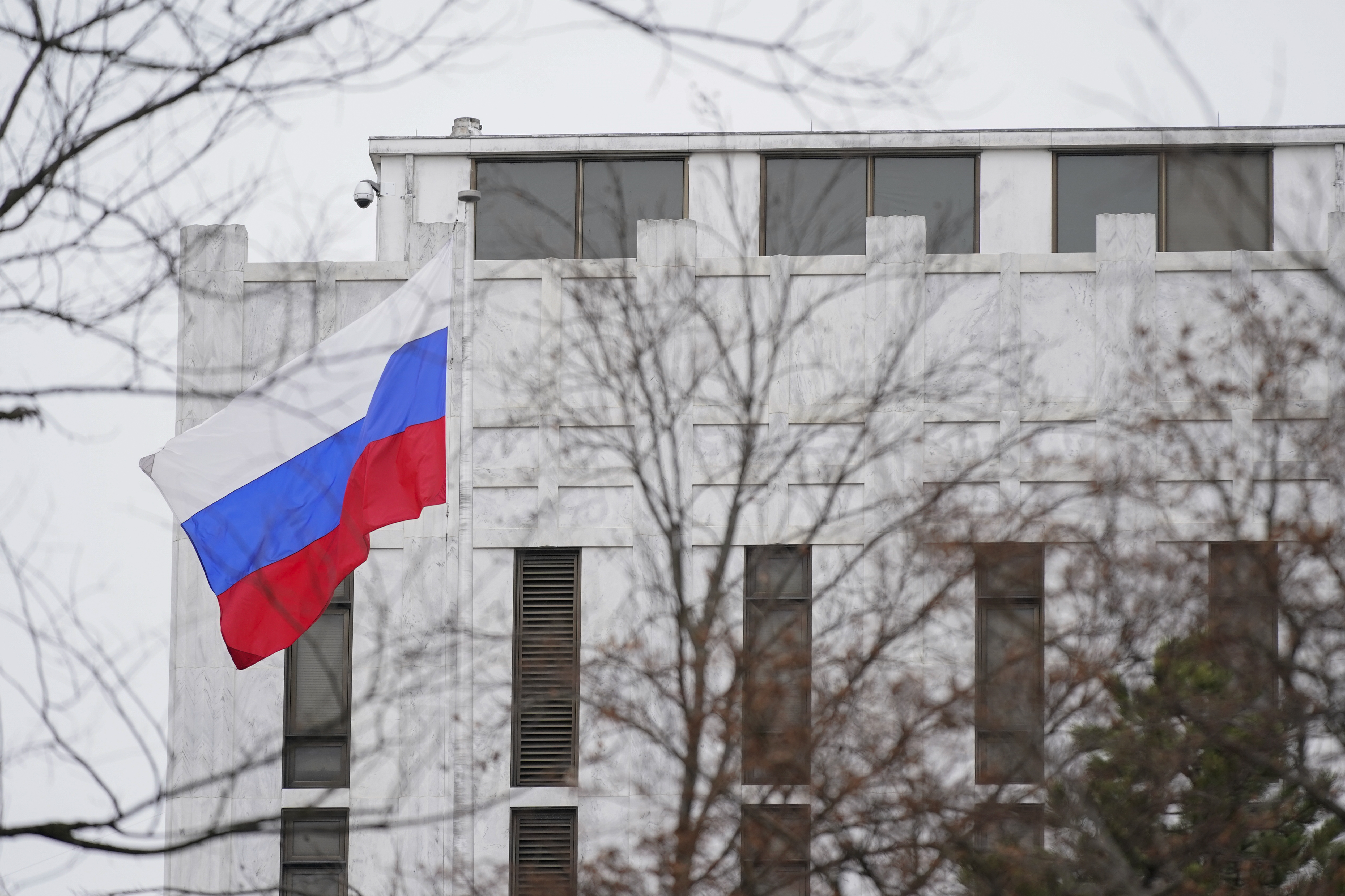 The Russian flag flies outside the Embassy of Russia in Washington