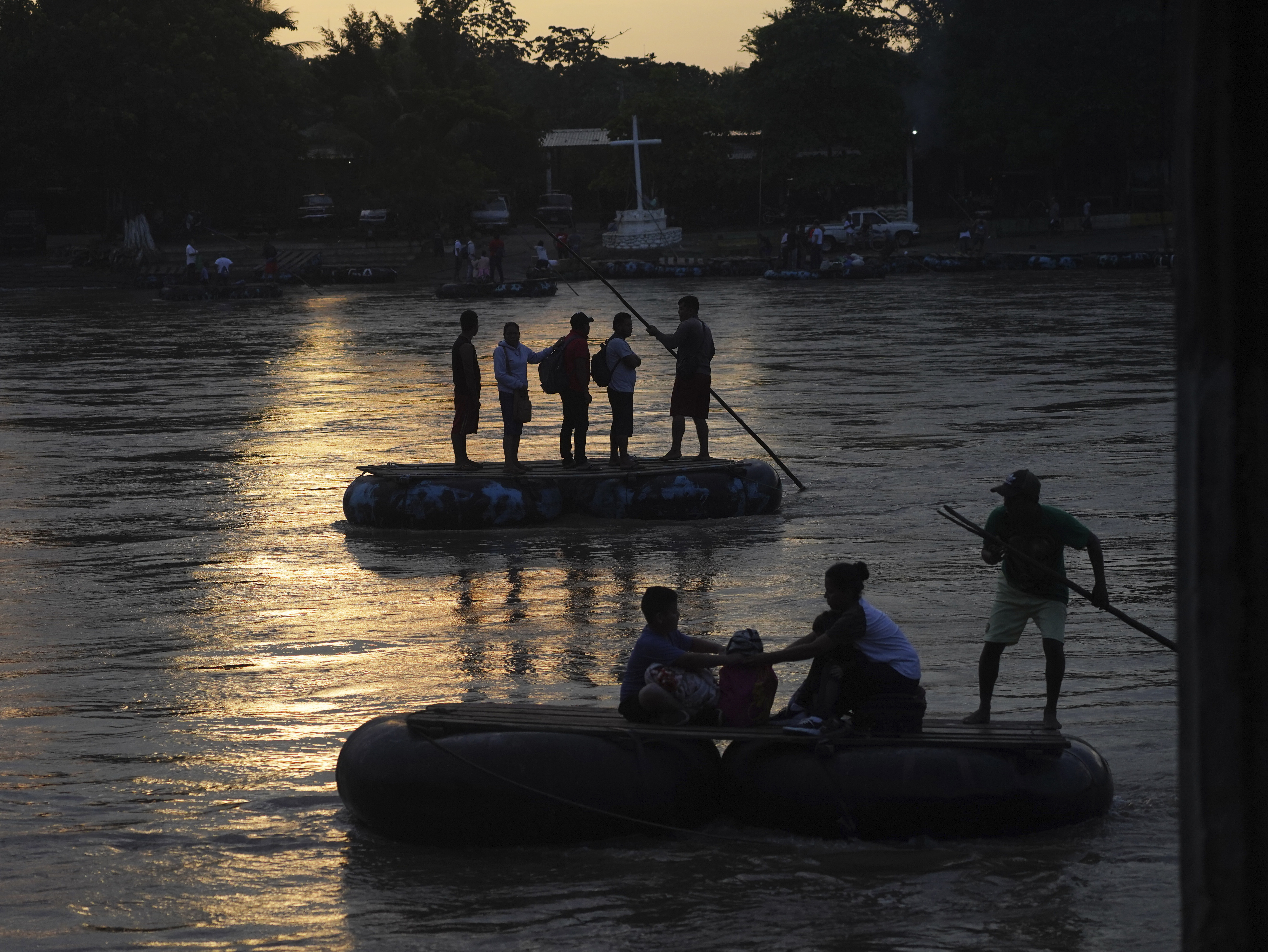 Venezuelan migrants cross the Suchiate River