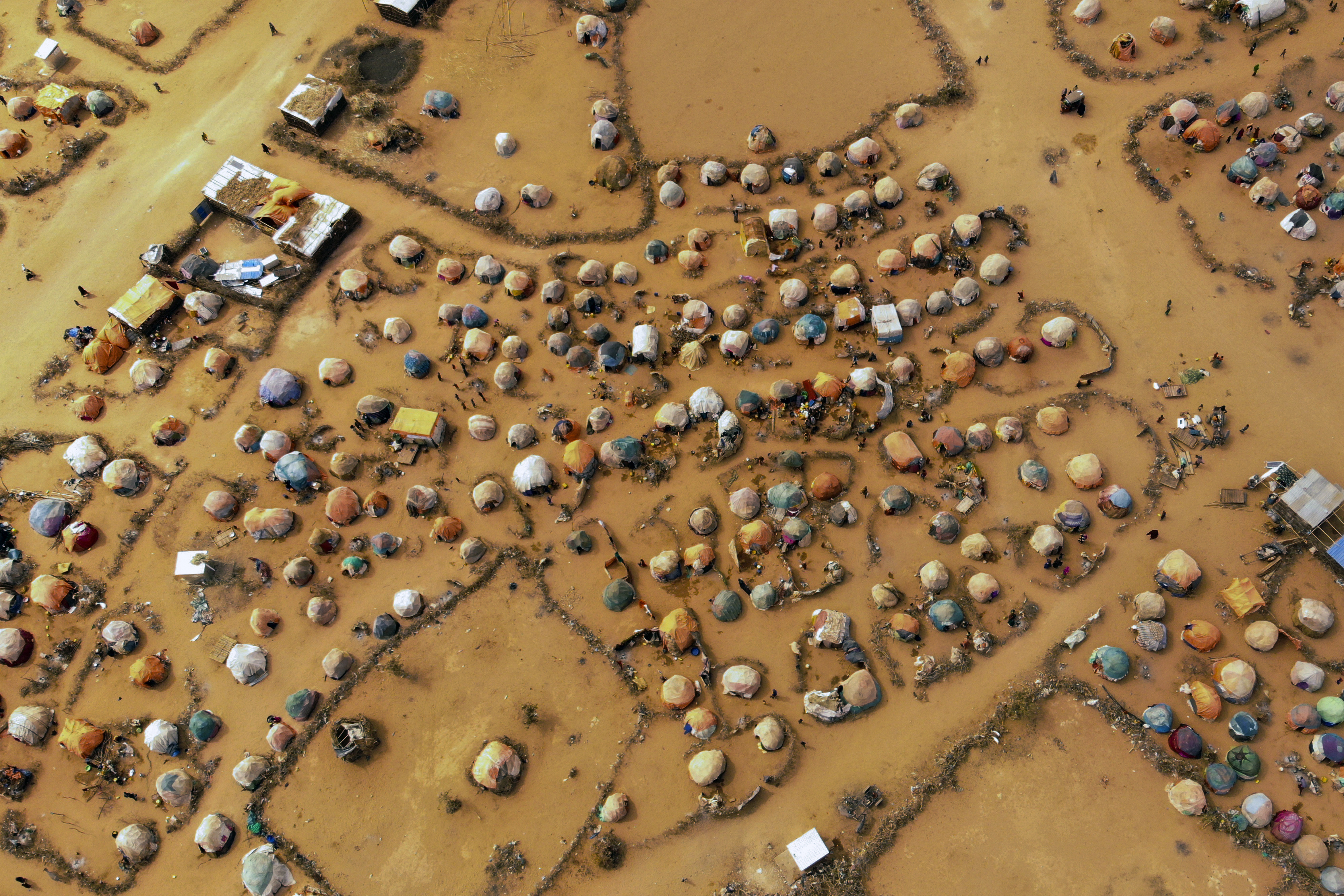 Huts made of branches and cloth provide shelter to Somalis displaced by drought on the outskirts outskirts of Dollow, Somalia