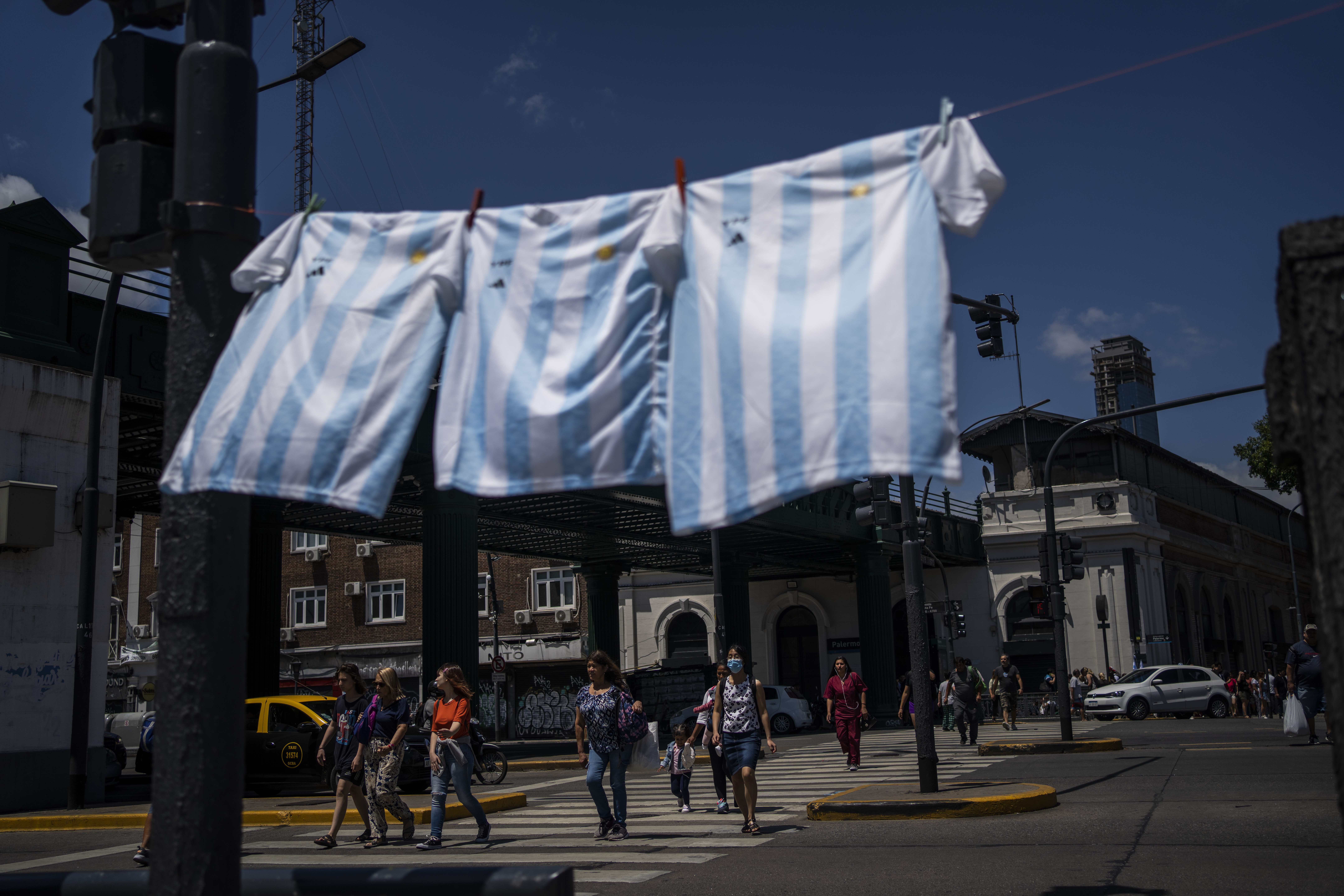 Argentina football jerseys hang for sale ahead of the team's World Cup final against France
